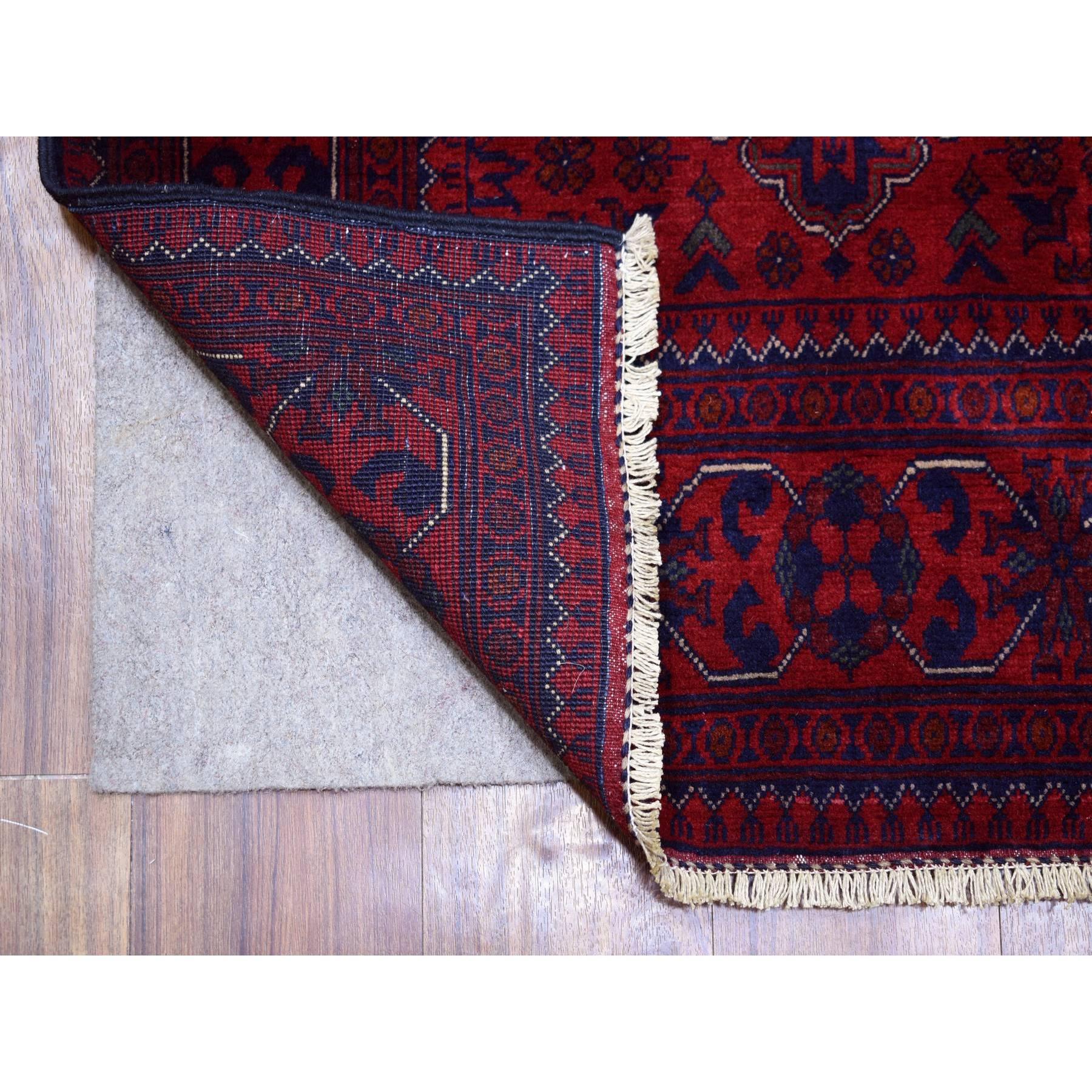 This is a truly genuine one-of-a-kind Deep and Saturated Red with Touches of Navy Blue, Soft and Shiny Wool Hand Knotted, Afghan Khamyab with Large Tribal Medallions Design, Runner Oriental Rug. It has been Knotted for months and months in the