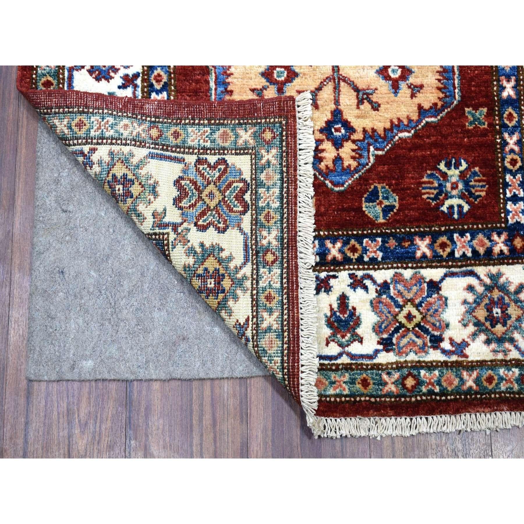 This is a truly genuine one-of-a-kind Deep Red Super Kazak with Tribal Medallions Hand Knotted Organic Wool Oriental XL Runner Rug. It has been Knotted for months and months in the centuries-old weaving craftsmanship techniques by expert