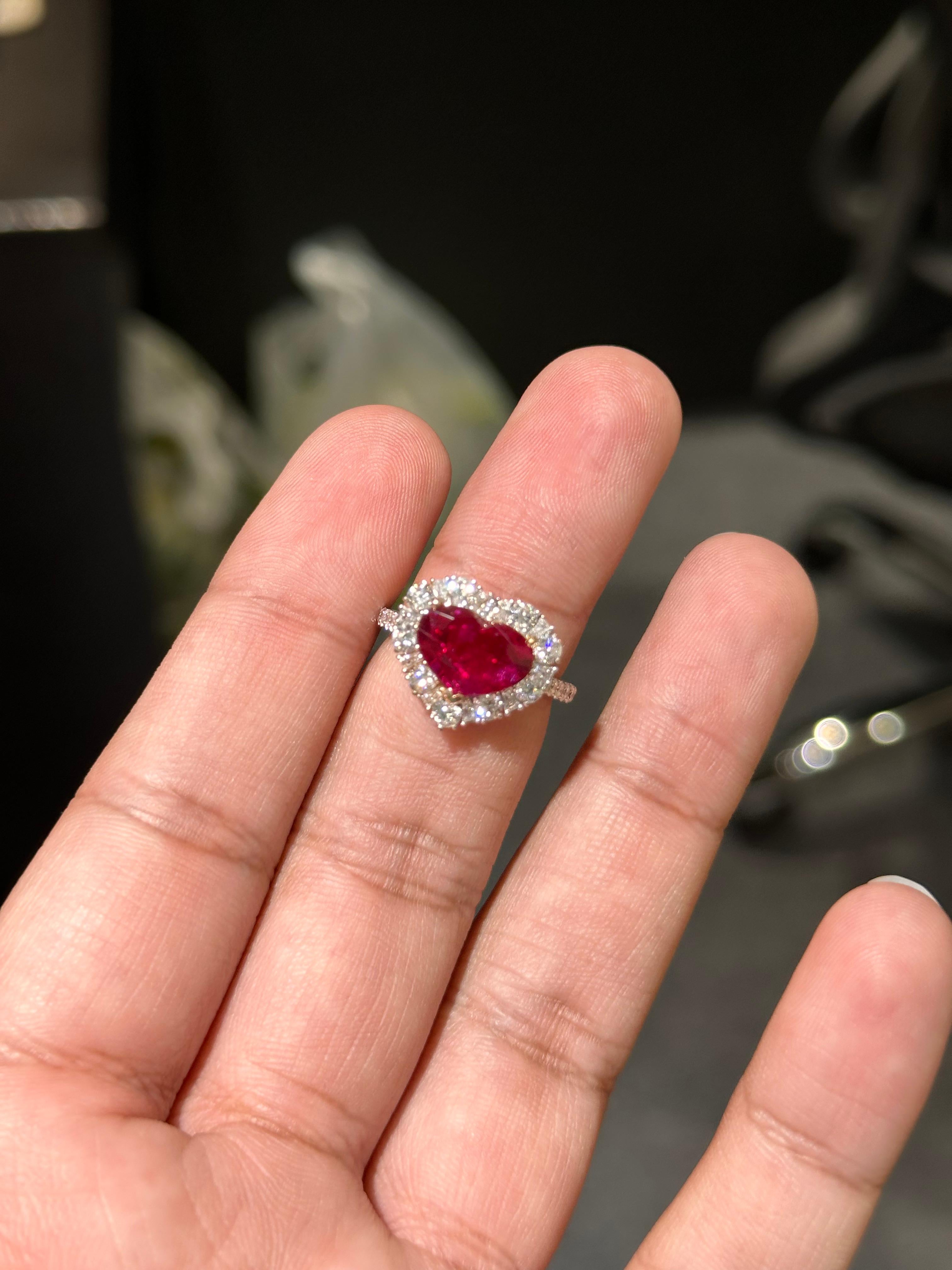 Indulge in the allure of exquisite jewelry with this captivating Ruby ring, a treasure that will leave all ruby lovers delighted. 

This magnificent ring showcases a breathtaking centerpiece—a 2.11  Carat heart-shaped Ruby, radiating an opulent,
