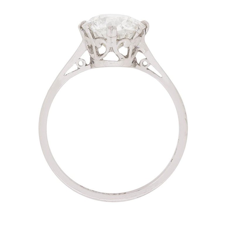 This beautiful ring dates back to the 1920s and is classic in design. The shining diamond weighs 2.11 carat and has been graded as H in colour and SI2 in clarity. The certification is EDR, based in London. The timeless claw setting with double