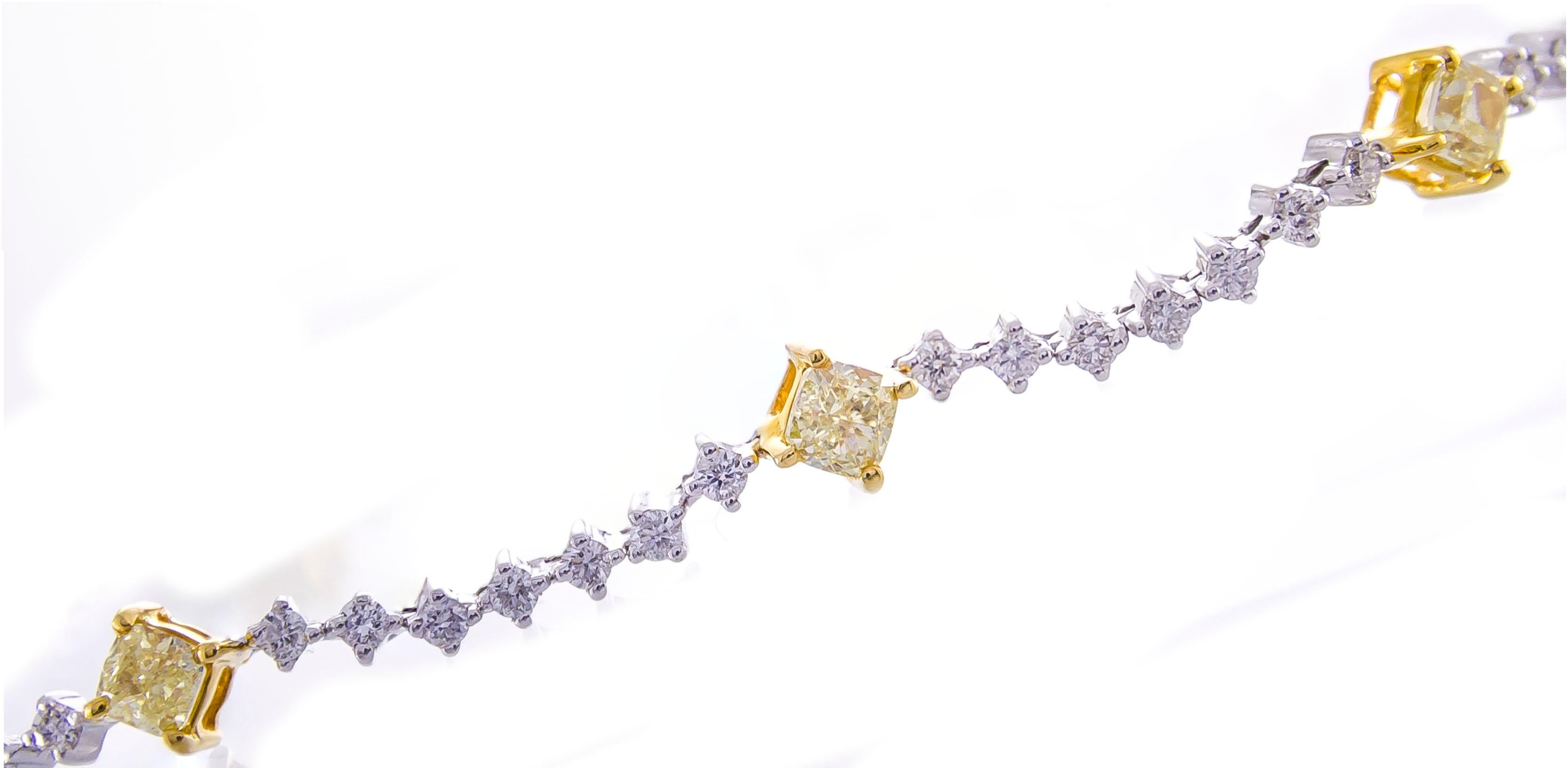 This beautiful bracelet is crafted in 14-karat Two Tone Gold. It features 8 glistening cushion cut yellow Diamonds 2.11 Carat - SI quality, connected by 56 white Round Diamonds 1.20 Carat GH-SI quality. This bracelet is 7.5