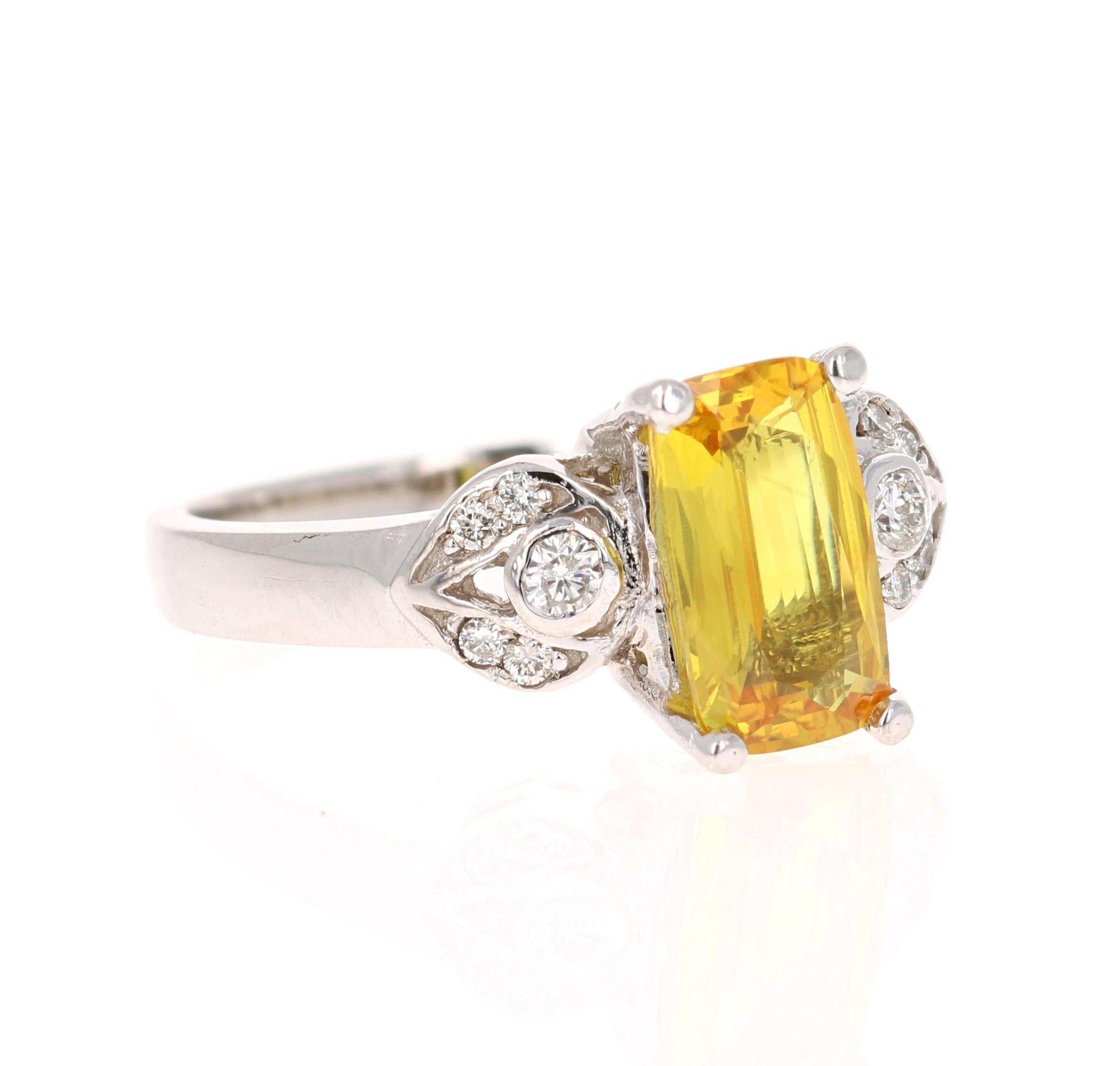 This beautiful ring has a Emerald Cut Yellow Sapphire that weighs 1.94 Carats. It is surrounded by 10 Round Cut Diamonds that weigh 0.17 Carats. (Clarity: VS, Color: H) 
The Yellow Sapphire measures at 7 mm x 8 mm and has indications of heating.