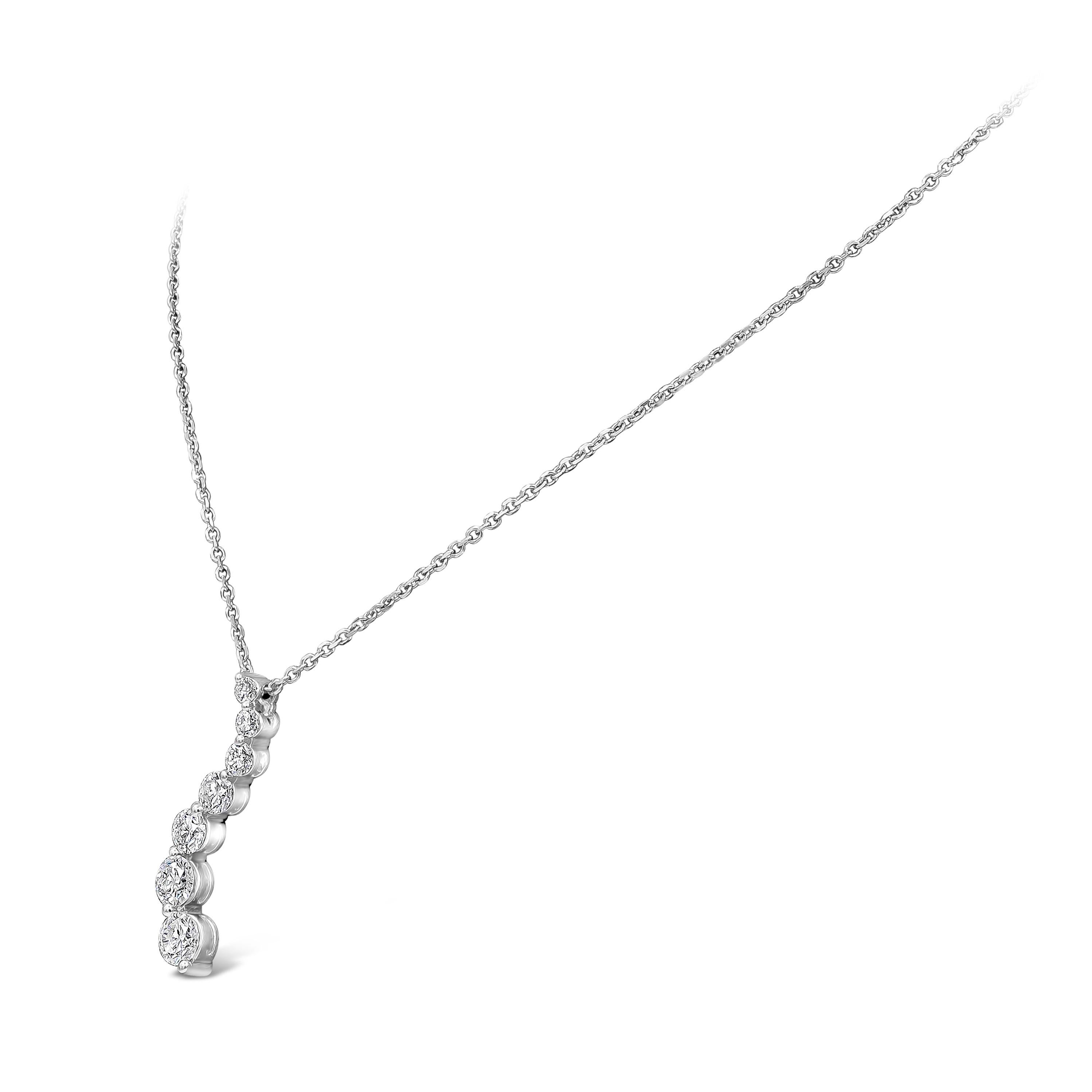 Showcasing a fashionable swirl design encrusted with graduating round brilliant diamonds weighing 2.11 carats total. Made in 18k white gold. Suspended on an adjustable 16 inch white gold chain.
Length of pendant = 1.23 inches

Style available in