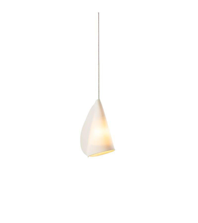 21.1 Porcelain Pendant Lamp by Bocci
Dimensions: Diameter 11.6 x H 300 cm 
Materials: Porcelain, borosilicate glass, braided metal coaxial cable, electrical components, brushed nickel canopy. 
Lamping: 1.5w LED or 20w xenon. Nondimmable.