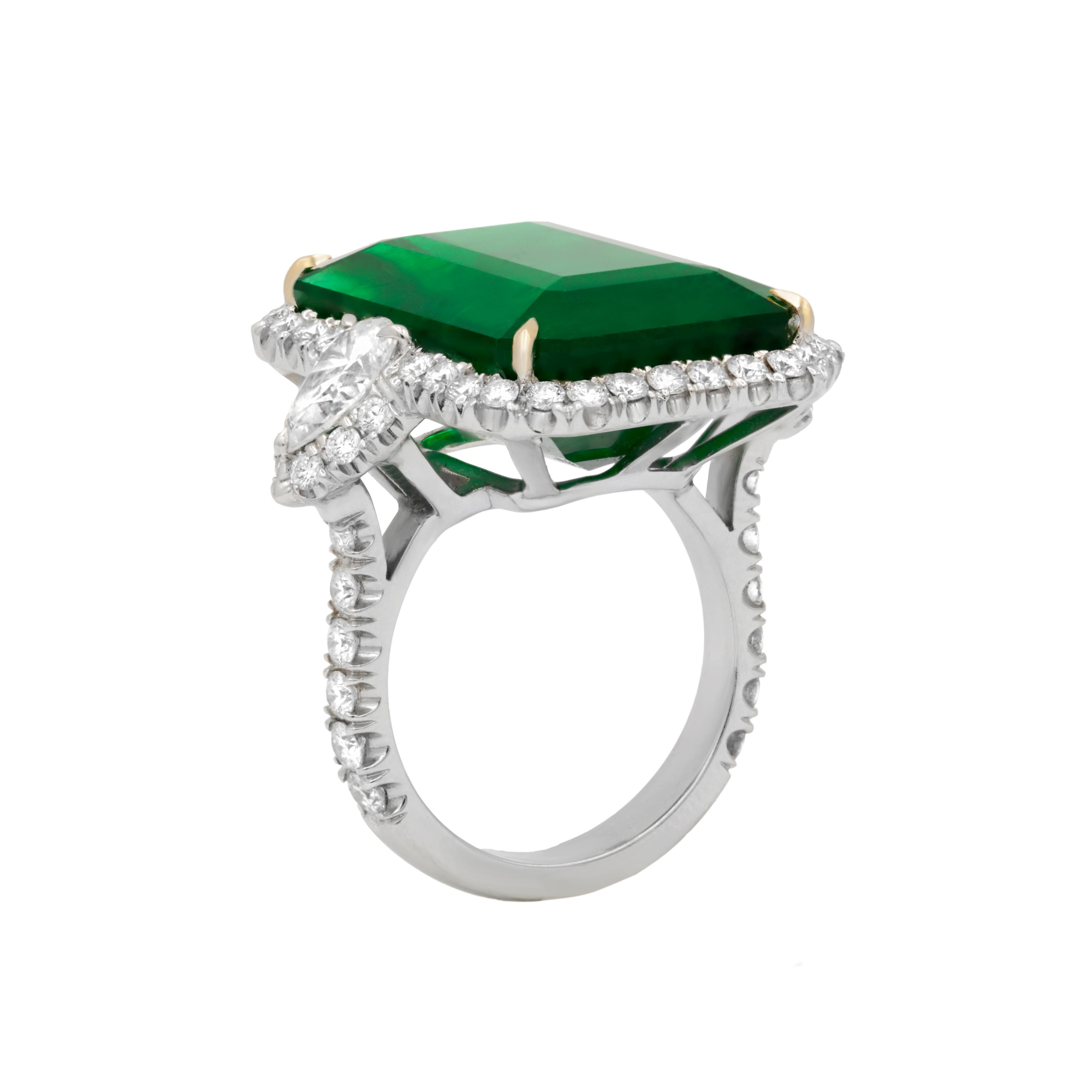 One GIA Certified Green Emerald and Diamond Ring, features 21.10 Carat Green Natural Emerald  (GIA#2155900531), elongated emerald cut shape, certified by GIA Laboratory. Set with 3.40 Carats of diamonds, including two pear shaped diamonds on each