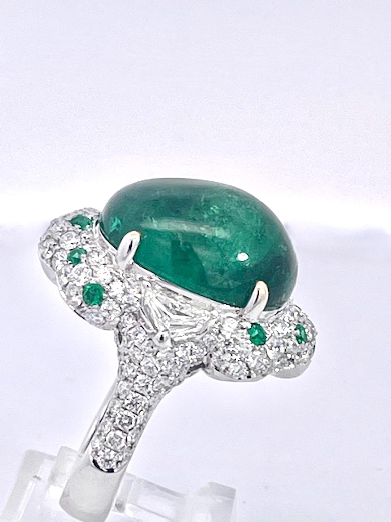 This amazing ring matches the Panther Bracelet I just listed.  This is a natural Zambia  Emerald with minor clarity enhancement.  There are (2) triangle Diamonds on each side of emerald at 0.50 ct.  there are also 12 tiny Emeralds encrusted in
