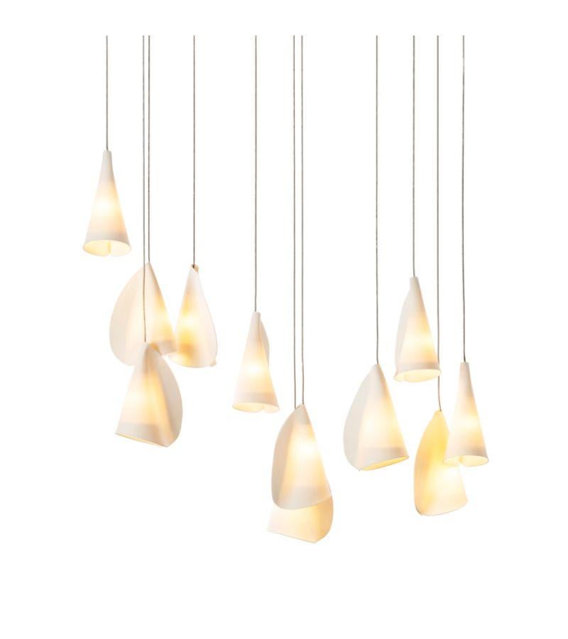 21.11 Porcelain Chandelier lamp by Bocci
Dimensions: 
Square Canopy: D 50.8 x W 50.8 x H 300 cm 
Rectangular Canopy: D 28.4 x W 85 x H 300cm 
Materials: Porcelain, borosilicate glass, braided metal coaxial cable, electrical components, brushed