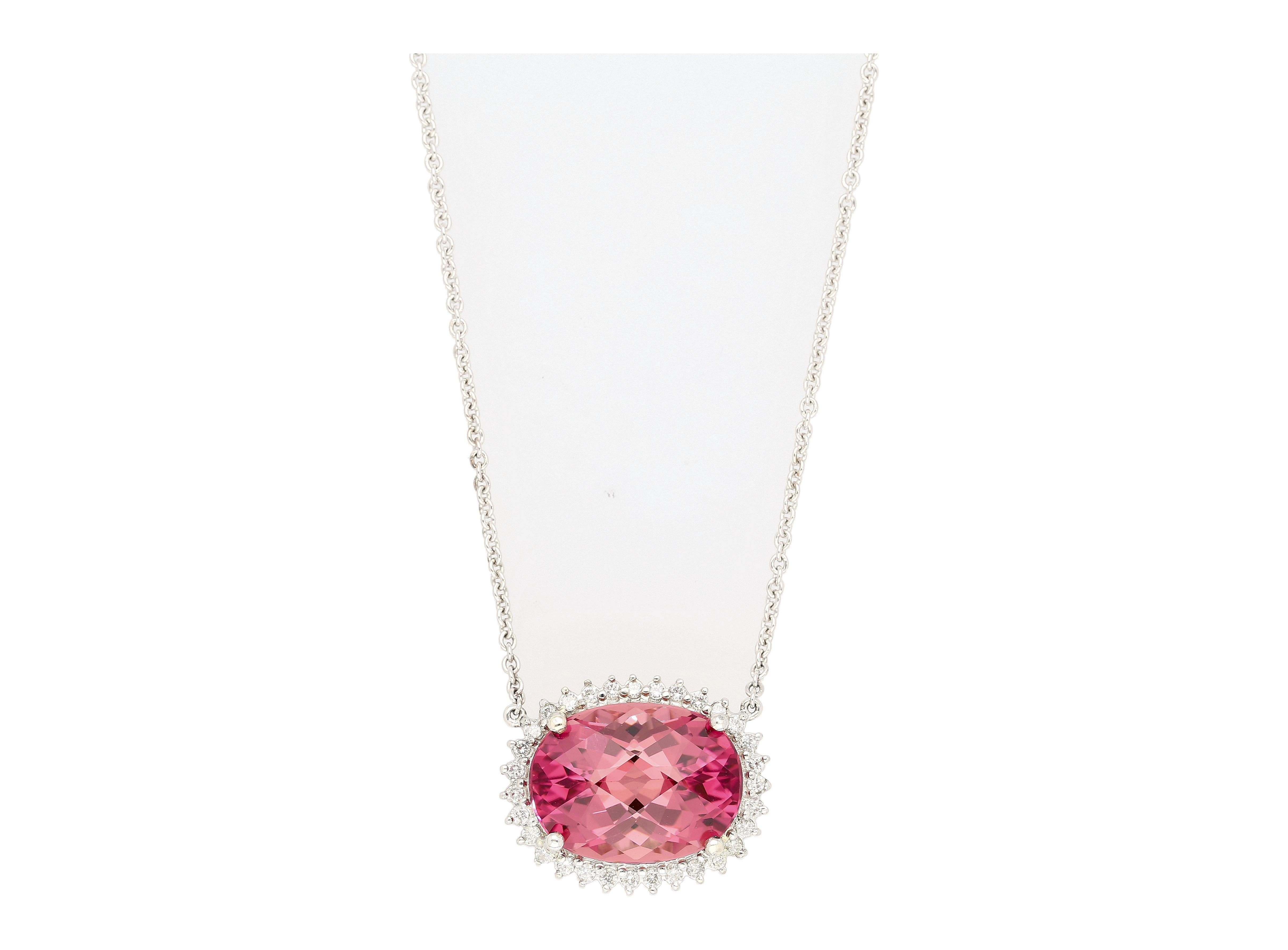 Natural Pink Tourmaline & Diamond Halo Floating Pendant Necklace in 14K/18K Gold. 

This chain necklace is crafted from 18k white gold and measures 18 inches in length, weighing 5 grams. The pendant stone is a natural pink tourmaline weighing 21.13