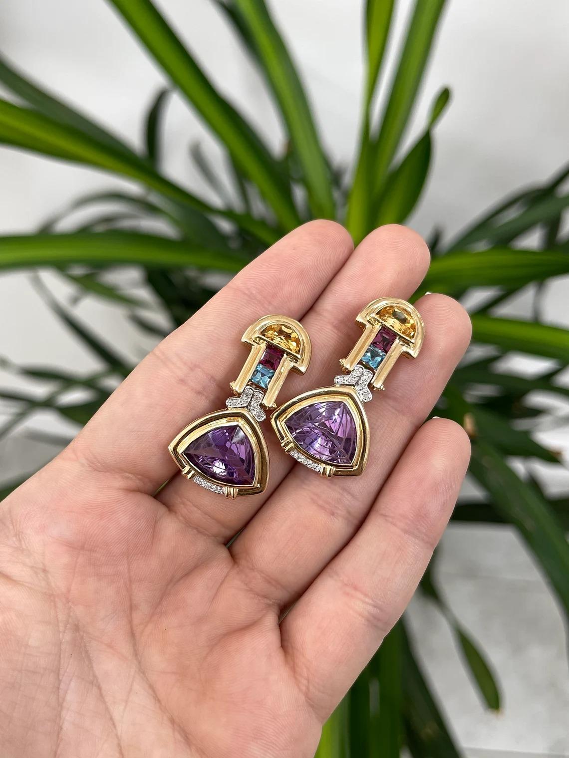 A gorgeous, and one of a kind piece set of multi-gemstone earrings. This lovely and exotic pair features five different stunning colored precious gemstones, such as Amethyst, Diamond, Blue & Pink Topaz, and Citrine. These gems come in multiple