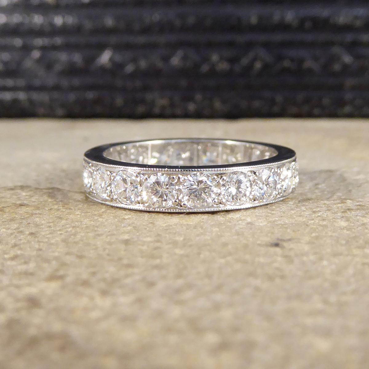 Dare to dazzle with this alluring contemporary eternity ring modelled in Platinum. It features 20 Brilliant Cut Diamonds weighing a total of 2.11ct, and sparkles from every angle.

Diamond Details:
Cut: Brilliant Cut
Carat: 2.52ct total
Colour: