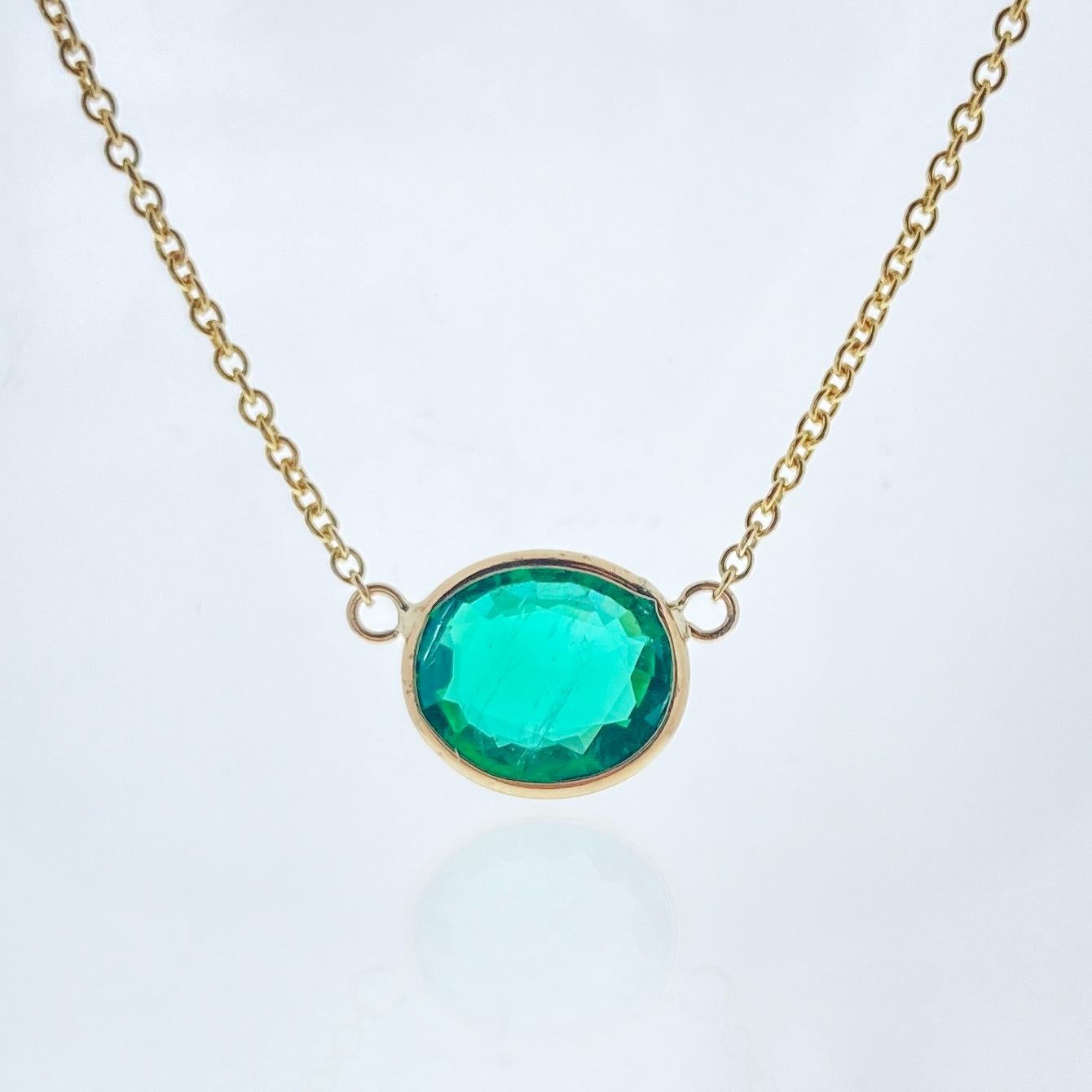 This necklace features an oval-cut green emerald with a weight of 1.62 carats, set in 14k yellow gold (YG). Emeralds are known for their rich green color, and the oval cut is a classic and timeless choice for gemstones, offering an elegant and
