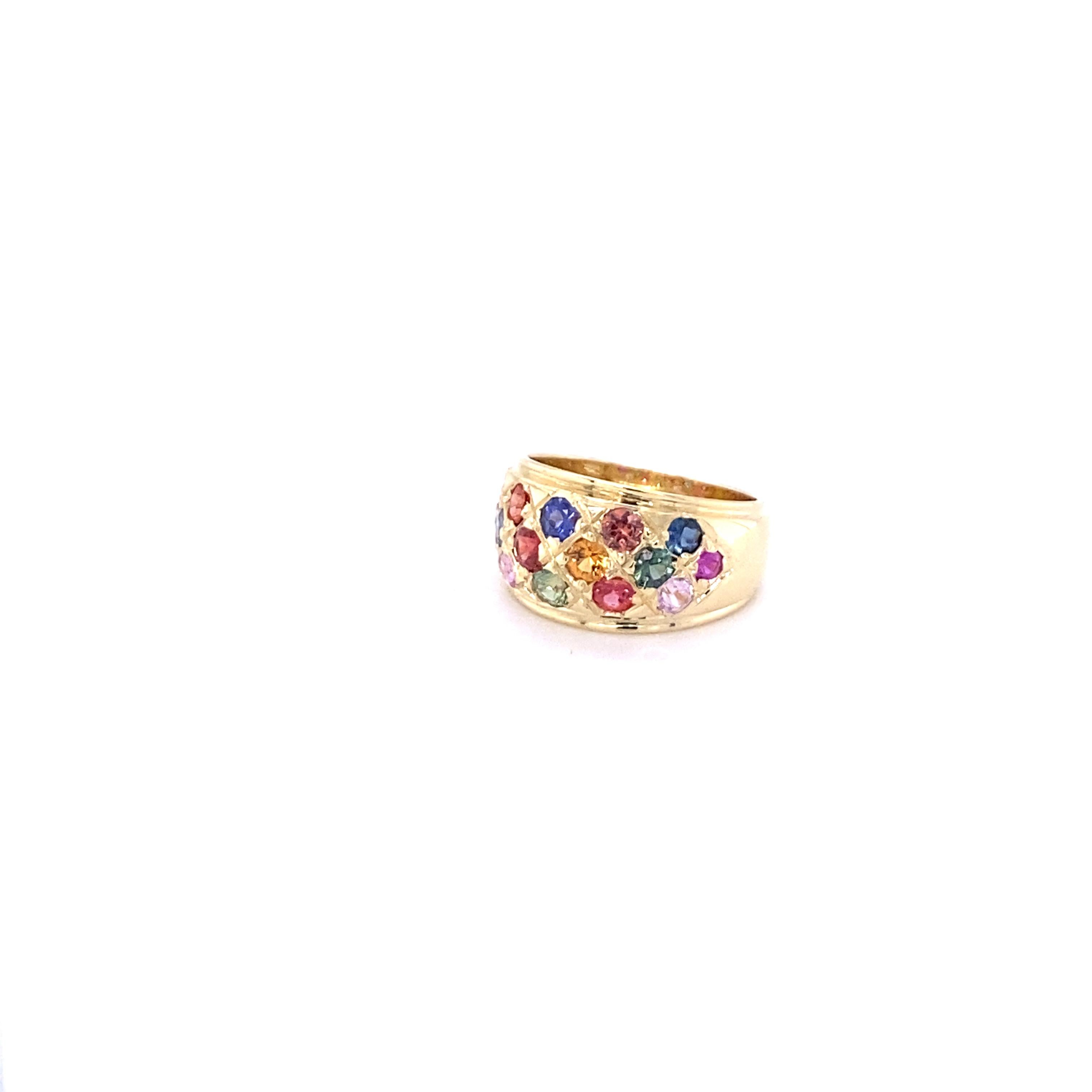 There are 16 Multicolored Natural Sapphires in this band that weigh 2.12 Carats.  It is made in 14K Yellow Gold and weighs approximately 7.0 Grams.

The band is a size 7 and can be re-sized at no additional charge.
This can be worn as an everyday