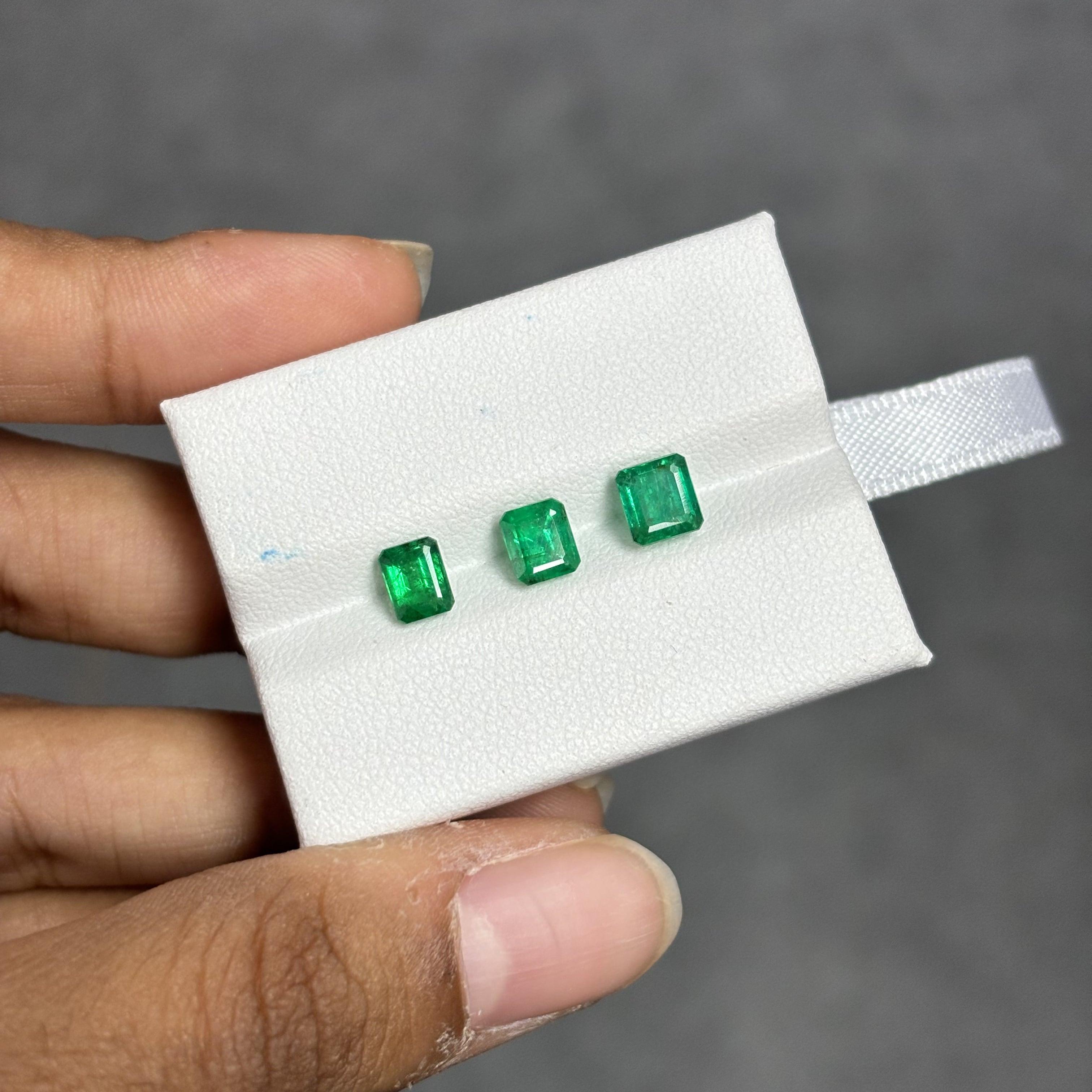 These stunning Emerald gemstones weigh a total of 2.12 Carat and are Panjshir Emeralds. They're vivid green in color and are cut into an emerald-cut shape. The individual weights of the Emeralds are 0.52, 0.75, and 0.85 Carat to be specific. They