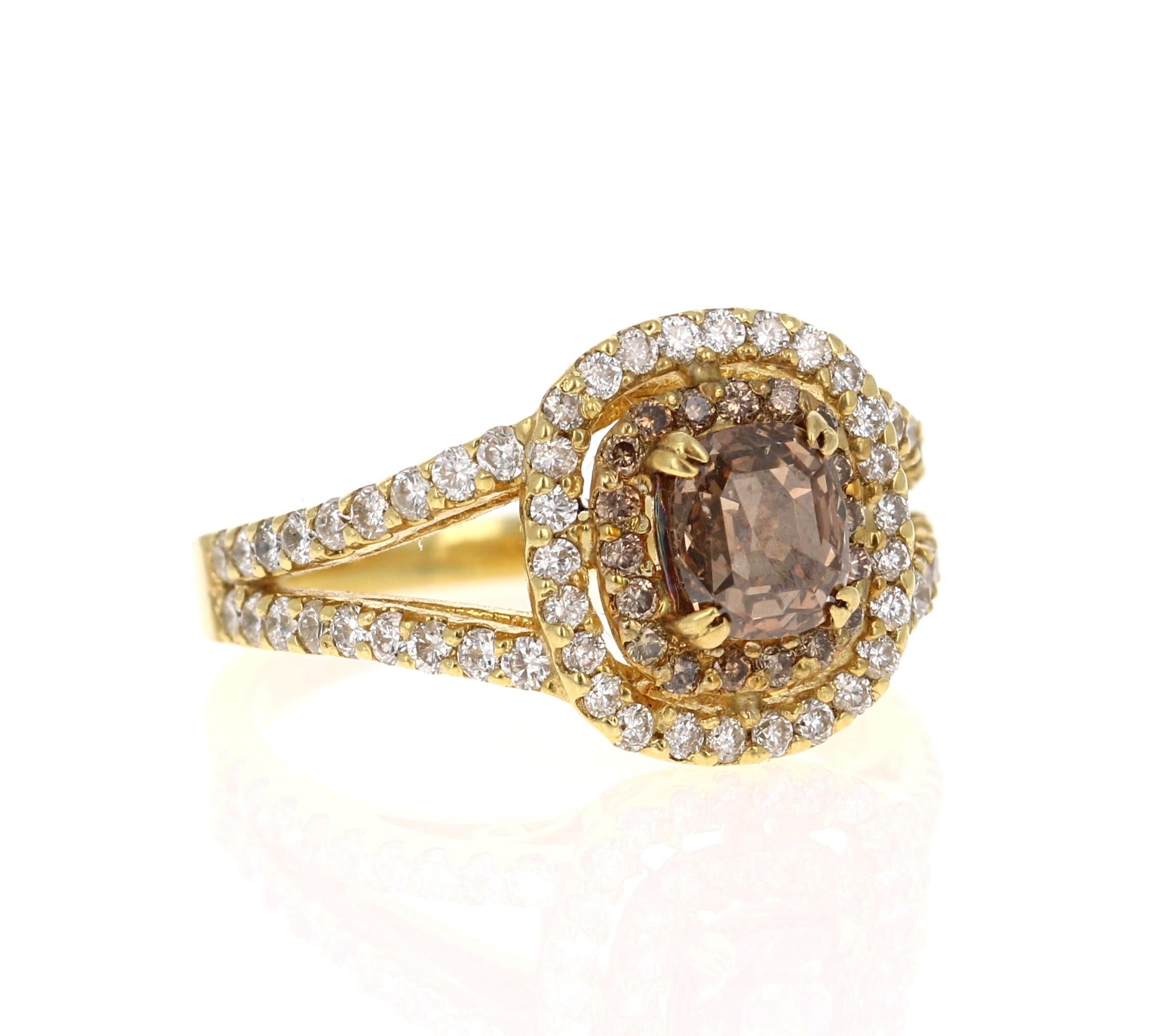 This beauty has a deep Brown/Champagne colored Natural Rectangular-Cushion Diamond that weighs 1.09 Carats (Clarity: VS2). It is surrounded by a row of 18 Natural Champagne Diamonds that weigh 0.15 Carats (Clarity: VS) and 62 Natural White Diamonds
