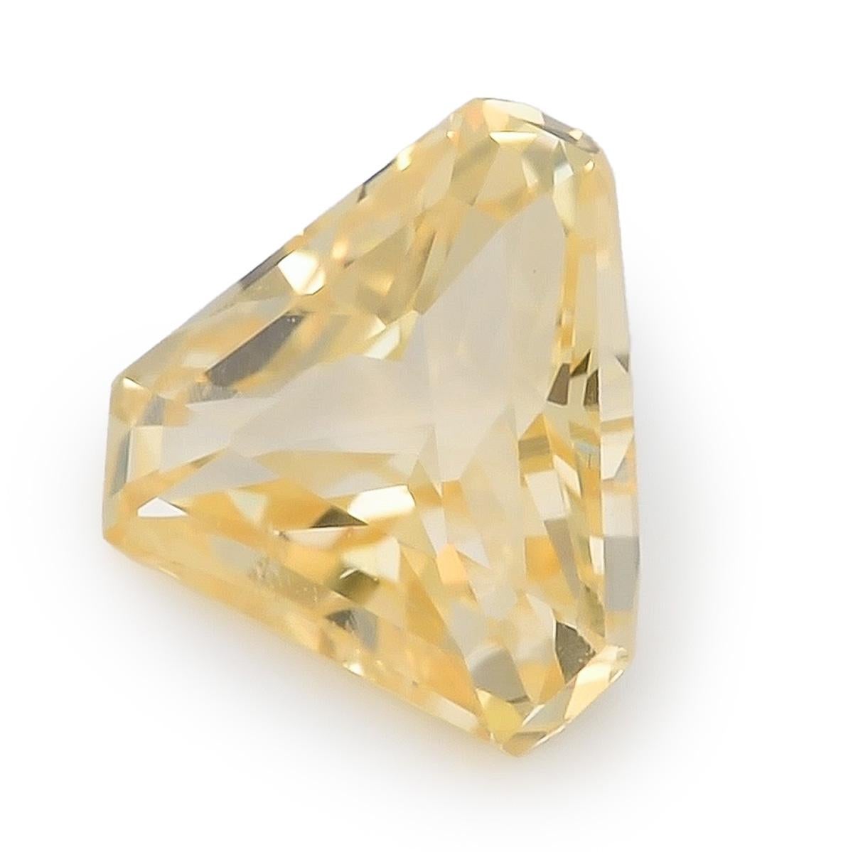 Immerse yourself in the captivating world of 2.12 carats Natural Yellow Sapphire from Sri Lanka. With its unique triangular shape measuring 7.83 x 8.18 x 4.59 mm, this gem exudes a vibrant yellow hue that radiates positivity. Its very clean clarity,