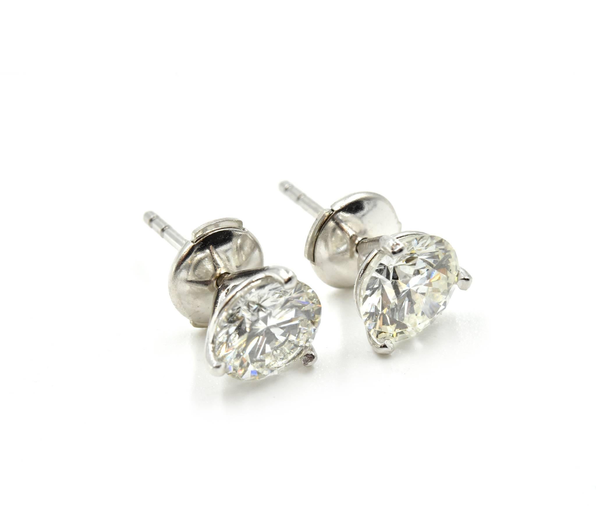 Designer: custom design
Material: 14k white gold
Diamonds: two round brilliant diamonds = 2.12 carat total weight
Color: G
Clarity: S1-S2
Fastenings: la pousette backs
Dimensions: each earring measures 7.00mm in diameter
Weight: 1.54 grams
