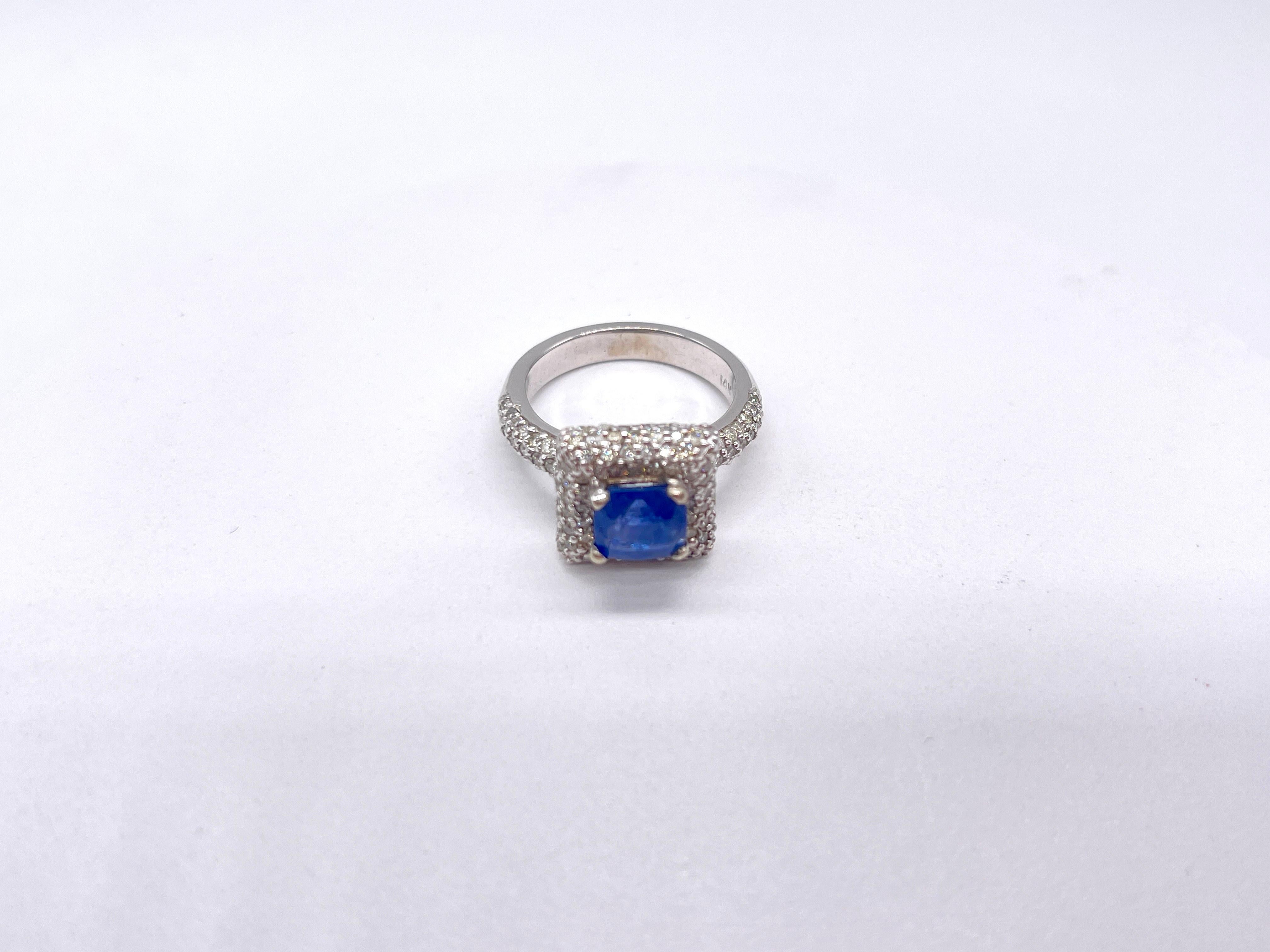 Gorgeous and unique 2.12 carats natural sapphire stone surrounded by 1.5 carats of natural diamonds set in 14K white gold.

Diamonds are average I-I quality, weighs 8.29 grams, ring size 7.

*Free shipping within the U.S.*