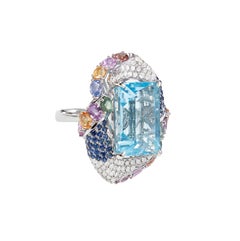 Sunita Nahata Sky Blue Topaz 21.20ct. Ring in 18KWG with Sapphire & Diamond.