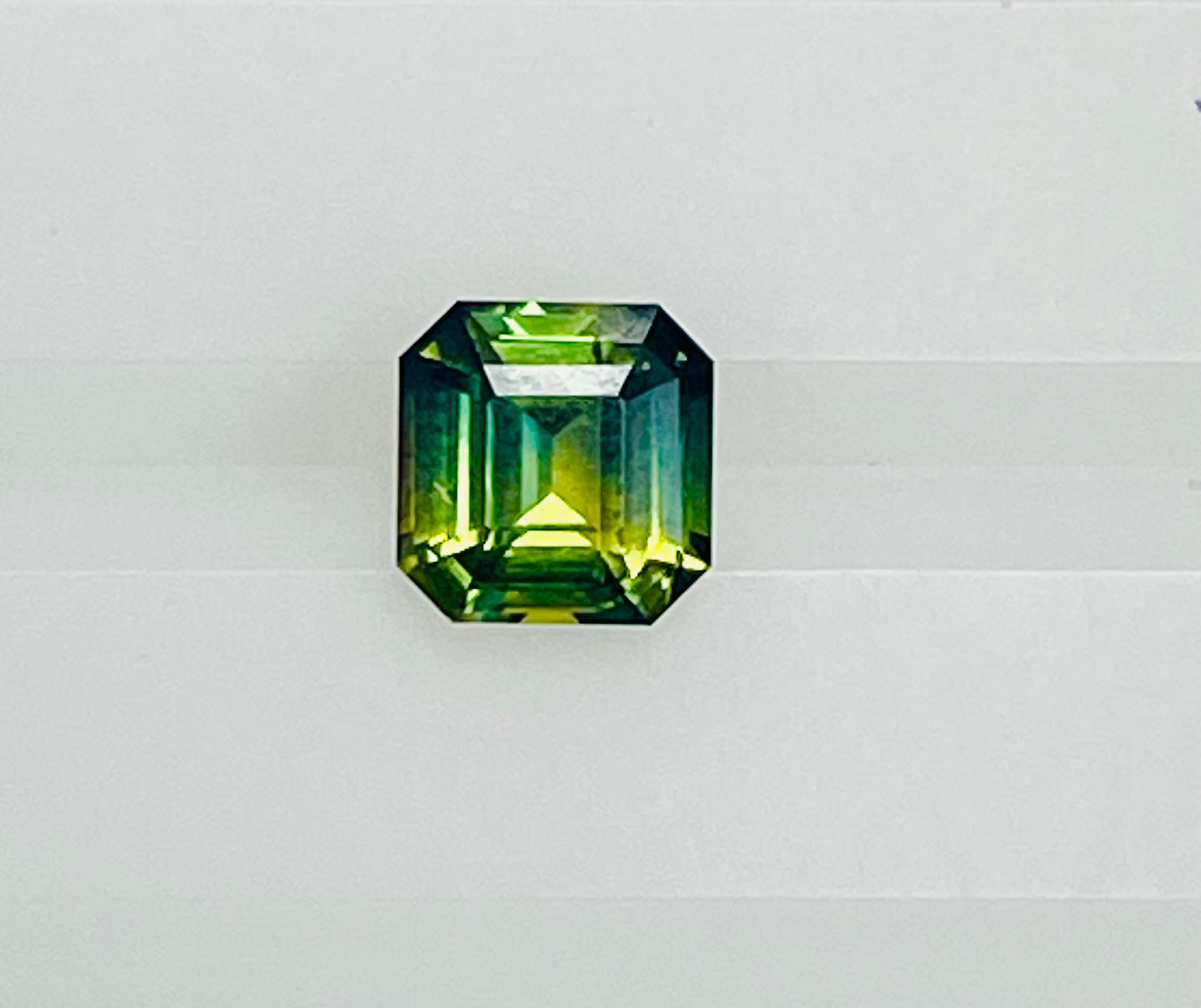 This 2.12 Ct square cut Bi color / Parti color sapphire exhibit  amazing mix of blue /green/ yellow colors in amazing colors and great shape and great luster .
One of a kind  mix of colors of sapphires in this 2.12 Ct sapphire .