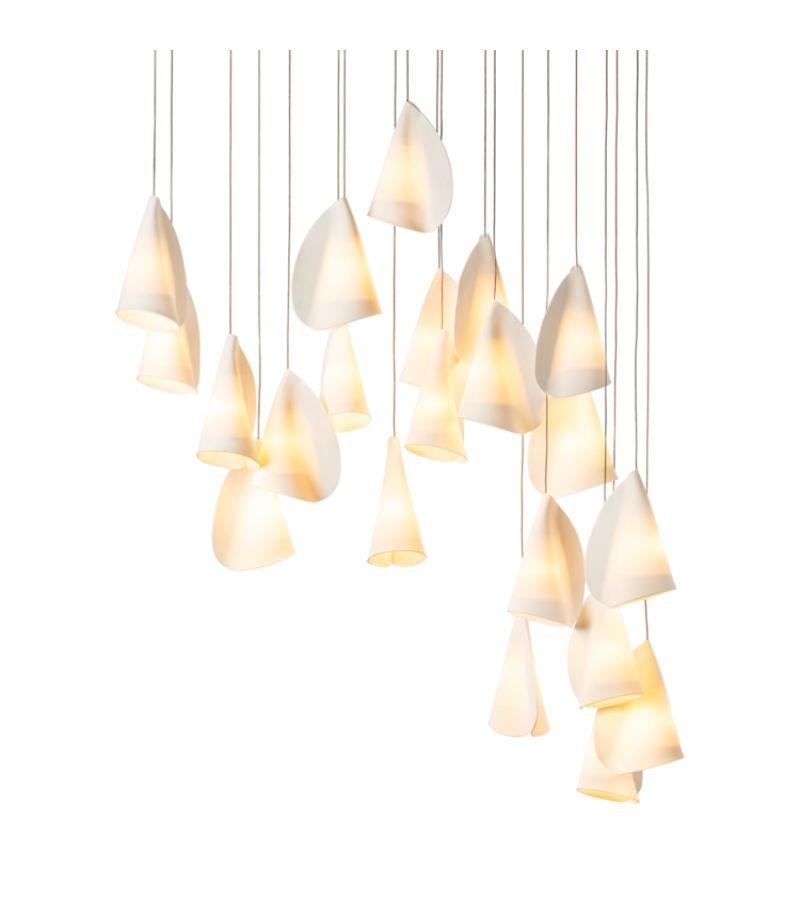 21.21 Porcelain chandelier lamp by Bocci
Dimensions: D 28.4 x W 85 x H 300 cm 
Materials: Porcelain, borosilicate glass, braided metal coaxial cable, electrical components, brushed nickel canopy. 
Lamping:1.5w LED or 20w xenon. Nondimmable.