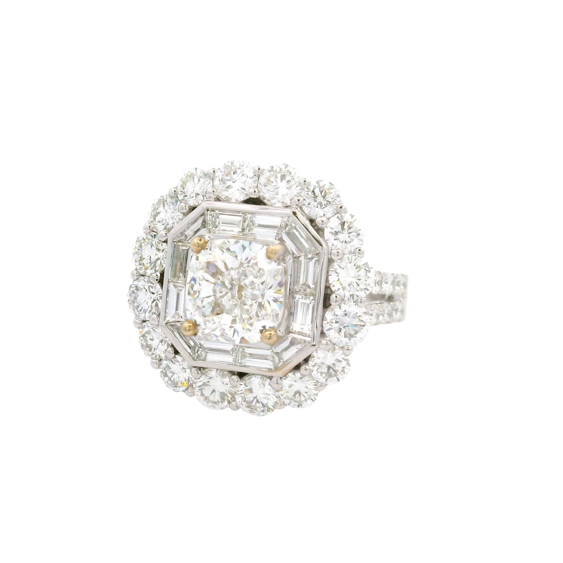 This brilliant engagement ring features a stunning cushion-cut white diamond, showcasing exceptional color and clarity with a VS2 grade and an E color grade. Surrounding the central diamond is a halo of mixed-cut white diamonds, totaling 3.26