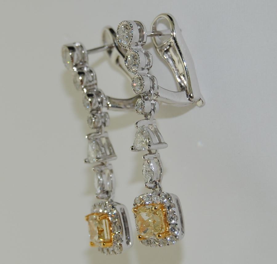 Features Cushion Center Fancy Diamond/Yellow Earrings, with Mixed Shaped White Diamonds total weight 2.13 Carats, made in 18 Karat White Gold.  Length 1 inch.    