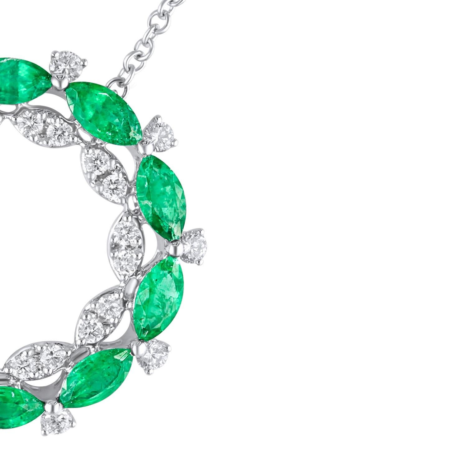 This beautiful circle pendant set in 18k White gold features a series of marquise cut emeralds (total weight 2.13 carats) alternating with round natural diamonds. Additional round diamonds form a circle of marquise forms, bringing the total diamond
