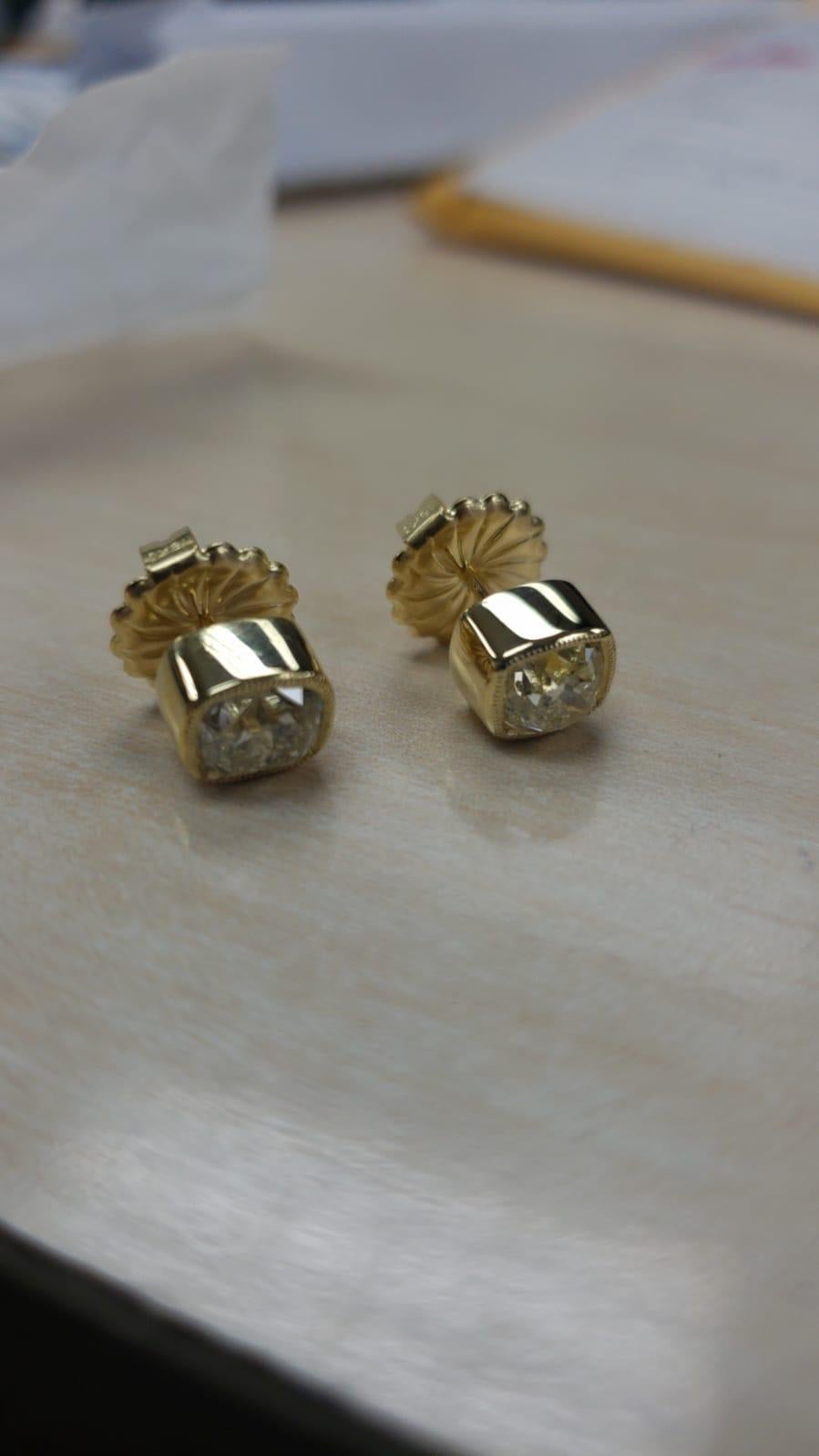 A lovely pair of old mine cut diamonds that sum together 2.13 carats.

The setting is gorgeous in solid 18 carats yellow gold and has security backs.