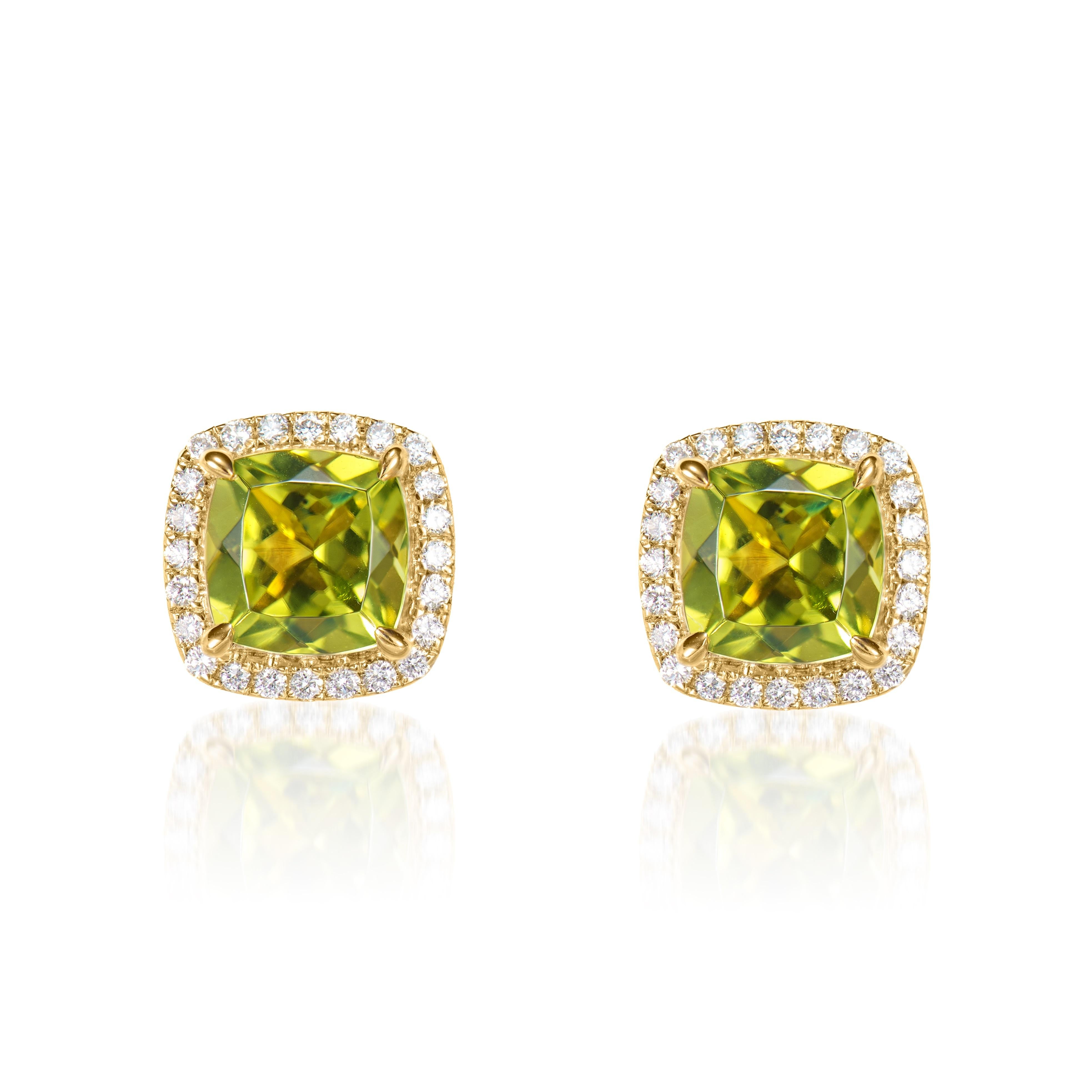 Contemporary 2.13 carat Peridot stud Earrings in 18Karat Yellow Gold with White Diamond. For Sale