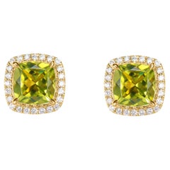 2.13 carat Peridot stud Earrings in 18Karat Yellow Gold with White Diamond.