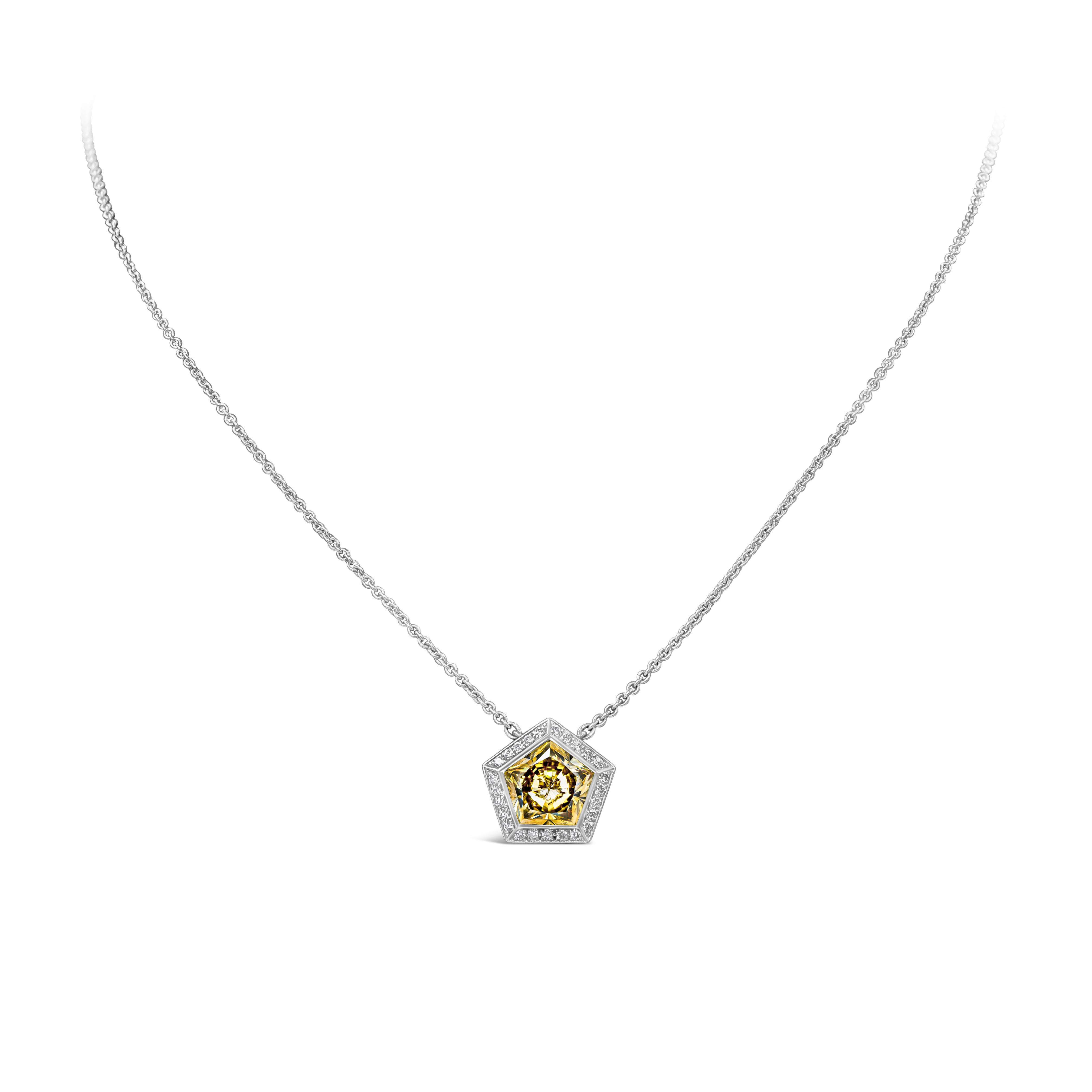 A stylish and unique pendant necklace showcasing a pentagon cut yellow diamond weighing 2.13 carats, set in a halo of round brilliant diamonds weighing 0.15 carats in total. Attached to an 18 inches adjustable white gold chain and Finely made in 18k