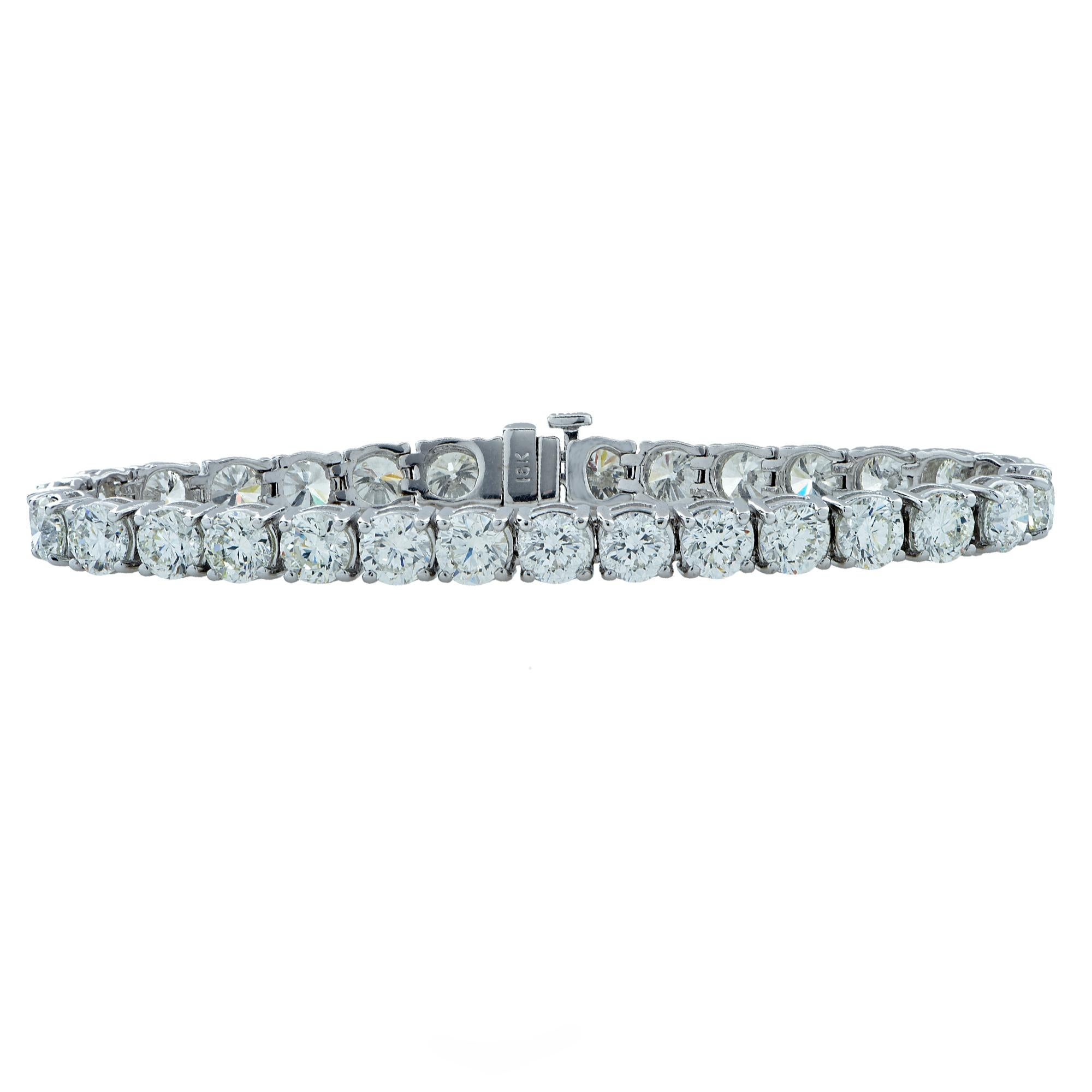 Envelop your wrist in a seamless eternity of diamonds with this spectacular diamond tennis bracelet crafted in 18 karat white gold showcasing 30 round brilliant cut diamonds weighing approximately 21.33 carats total, G-H color, SI1-2 clarity. This