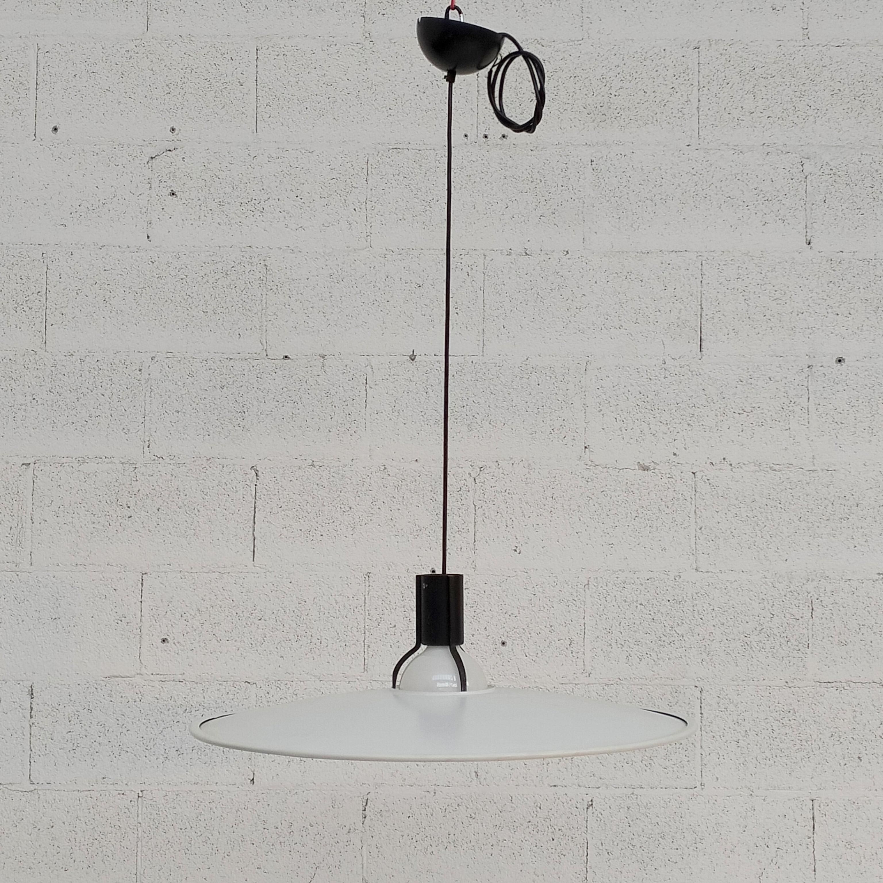Metal chandelier pendant lamp 2133 model designed by Gino Sarfatti and manufactured by Arteluce Italy 1970s.
White metal lampshade with black metal lamp holder, where the lampshade stays on. Mark present in the upper part. E27 connection.
Good