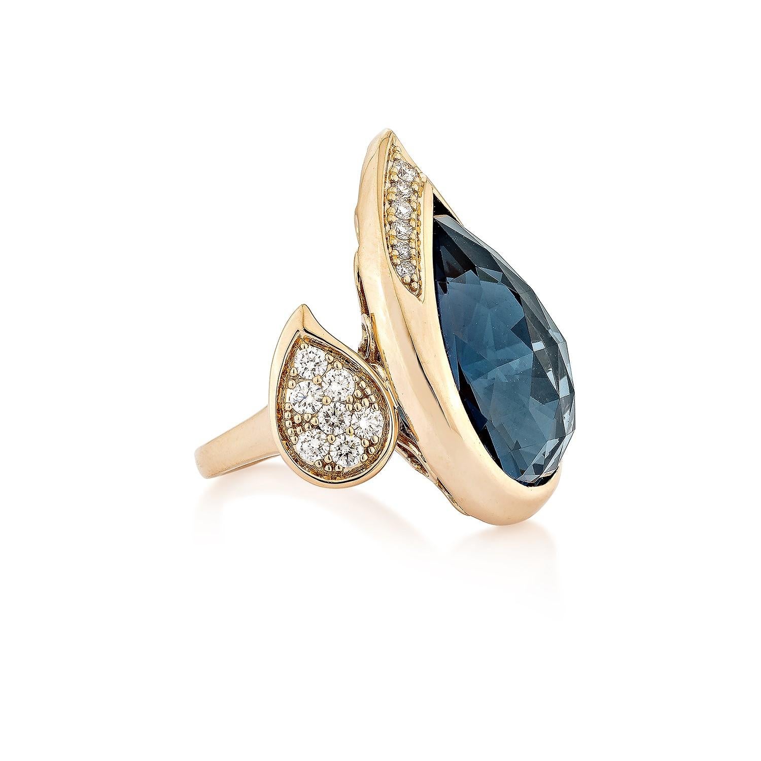 Bold blue topaz! Light and easy to wear, this fancy ring showcases deep blue topaz accented with diamonds. This exquisite 18-karat rose gold ring is ideal for any special occasion because it combines traditional elegance with modern flair.

London