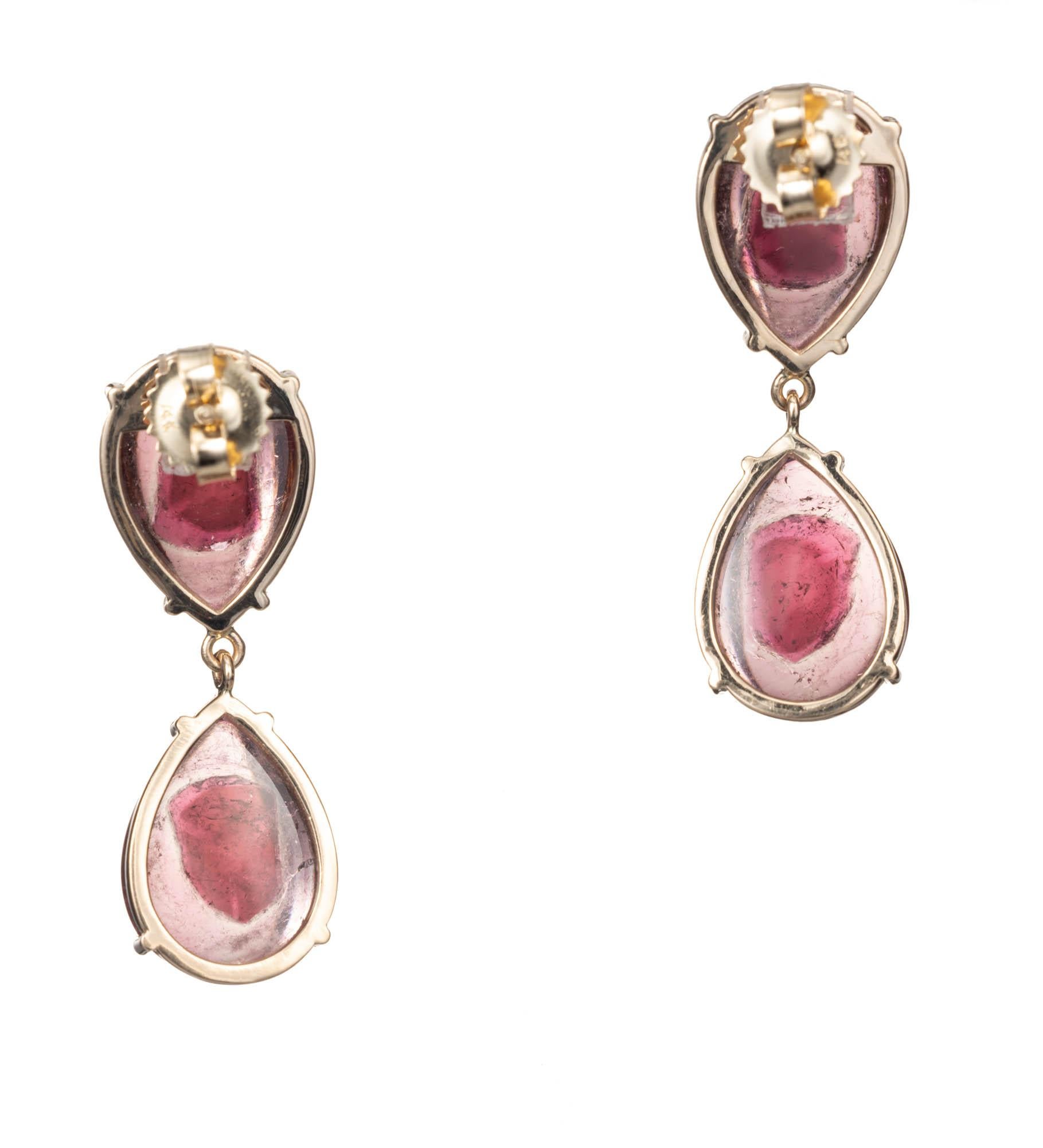 21.36ct pear cabochon Tourmaline 14k yellow gold dangle earrings. 

4 pear pink cabochon Tourmaline, approx. total weight 21.36cts, 15 x 11mm 
14k yellow gold 
Tested and stamped: 14k
9.3 grams 
Top to bottom: 34.56mm or 1.36 inches 
Width:11.74mm