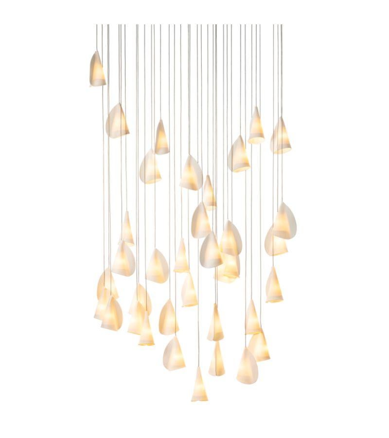 21.36 Porcelain chandelier lamp by Bocci
Dimensions: D 37 x W 110 x H 300 cm 
Materials: porcelain, borosilicate glass, braided metal coaxial cable, electrical components, brushed nickel canopy. 
Lamping: 1.5w LED or 20w xenon. Non-dimmable.