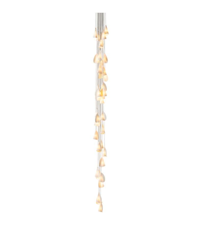21.37 Cluster Porcelain Chandelier lamp by Bocci
Dimensions: D 60 x H 300 cm 
Materials: Porcelain, borosilicate glass, braided metal coaxial cable, electrical components, brushed nickel canopy. 
Lamping: 1.5w LED or 20w xenon. Non-dimmable.
