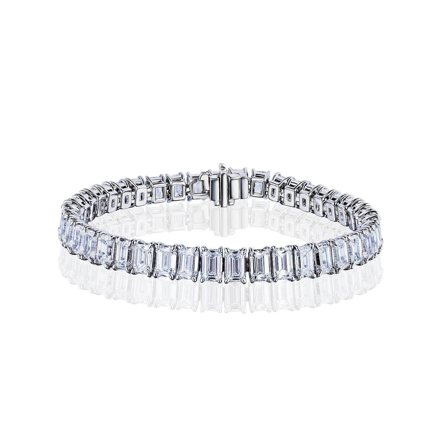 The Ultimate Diamond Tennis Bracelet. 

Perfectly Cut and Perfectly Matched Emerald Cut Diamonds in a straight line Tennis Bracelet.
43 Diamonds, weighing a total of 21.30 Carats.
F-G Color and VS Clarity.

Set in Platinum, 6.75 inches.