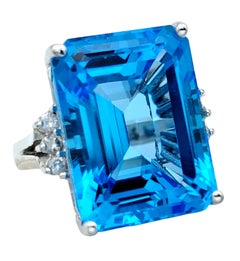 21.39 Carat Emerald Cut Blue Topaz Cocktail Ring With Diamonds in 14 Karat Gold