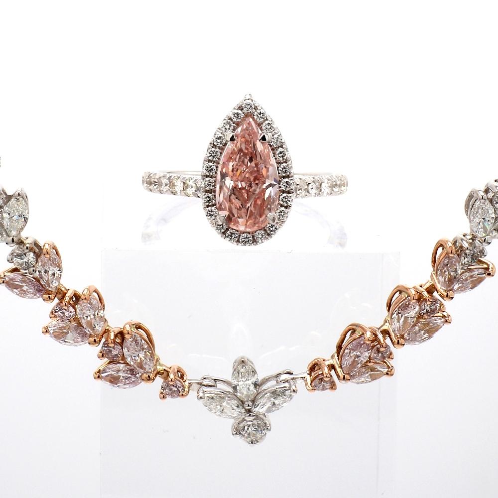 2.13ct Pear-Shaped Pink Diamond Ringent 

This elegant 2.13ct pear-shaped pink diamond ring, set in a two-tone 18K gold band with 0.57ctw of round brilliant diamonds, is GIA certified and weighs 31.4 grams. Resizable and designed for timeless
