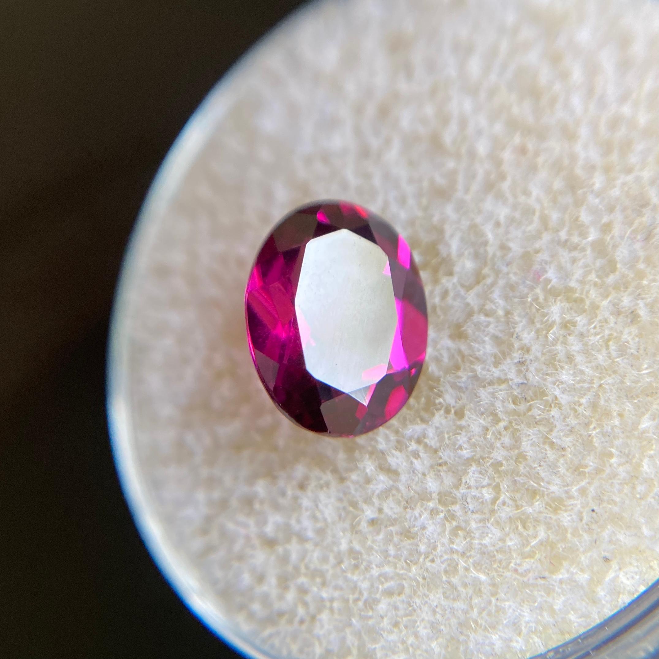 Fine Natural Rhodolite Garnet Gemstone.

2.13 Carat with a beautiful vivid purple pink colour and excellent clarity, very clean gem.

Has an excellent oval cut with good proportions and symmetry. It also has an ideal polish to show great shine and