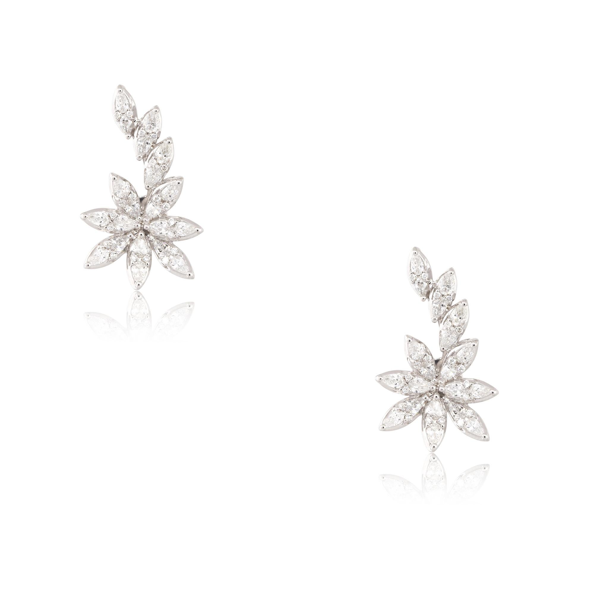 18k White Gold 2.14ctw Diamond Flower Crawler Earrings
Material: 18k White Gold
Diamond Details: Approximately 2.14ctw of Pear Shaped and Round cut Diamonds
Earring Backs: Elongated Friction Backs 
Item Dimensions: 16.9mm x 5.15mm x 27.8mm
Item