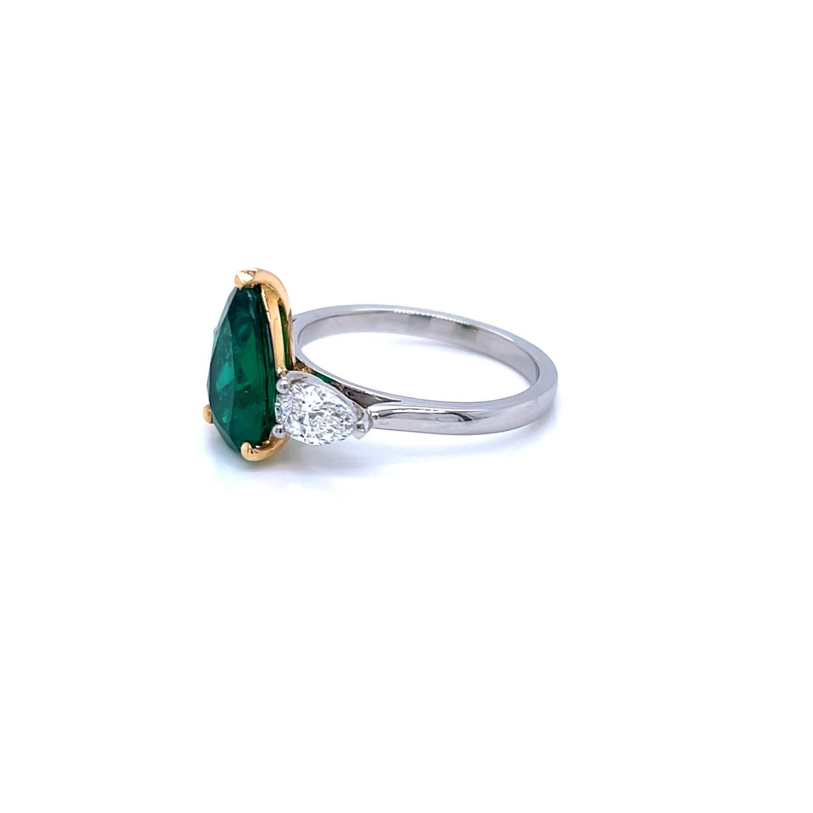 Contemporary 2.14 Carat Emerald and Diamond Three Stone Platinum Ring For Sale