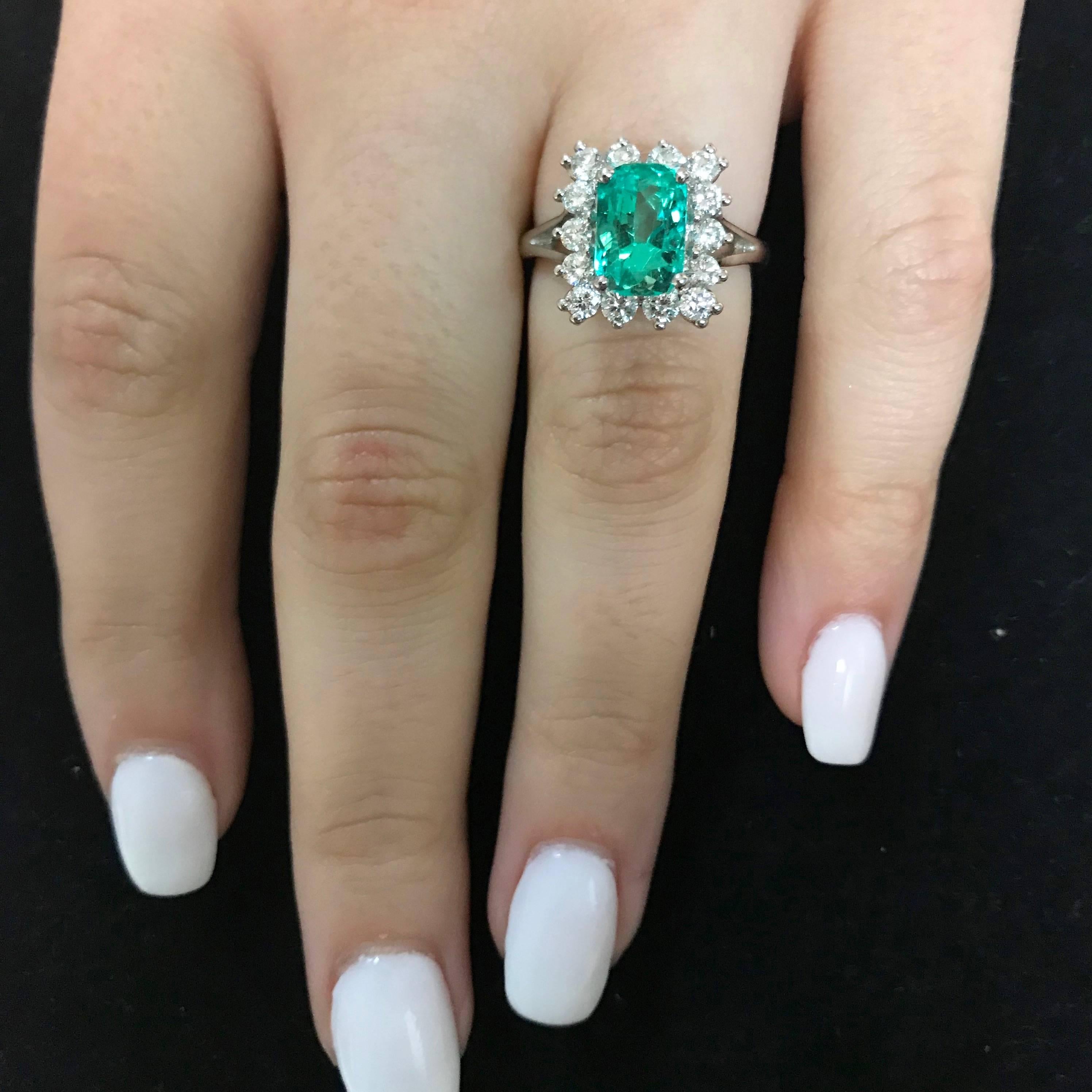 Material: 14k White Gold
Gemstones: 1 Emerald Cut Emerald at 2.14 Carats. 
Diamonds: 14 Brilliant Round White Diamonds at 0.60 Carats. Clarity SI. Color: H-I.
Ring Size: 6.25 (Can be sized)

Fine one-of-a kind craftsmanship meets incredible quality