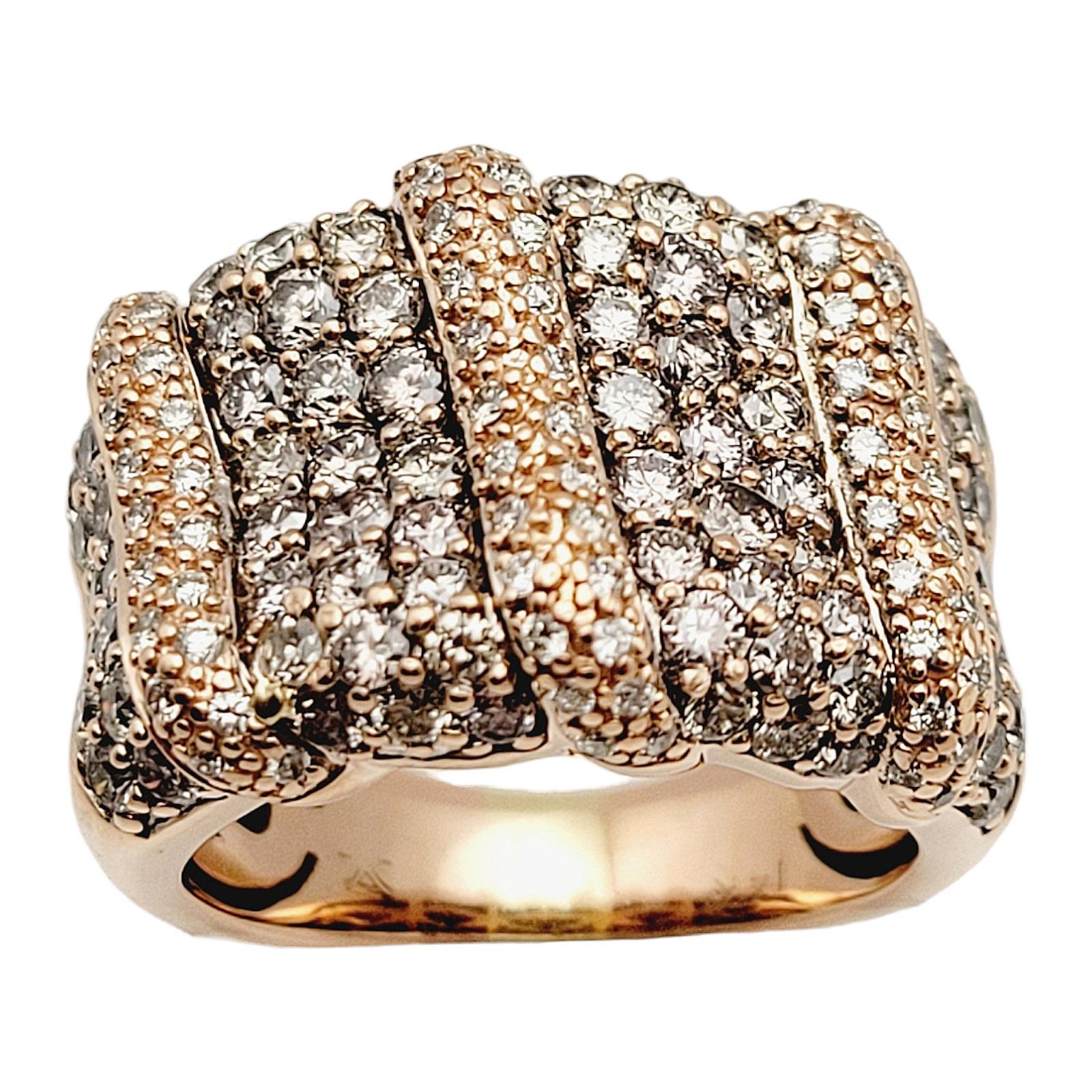 Ring Size: 6.25

This dazzling diamond pave band ring sparkles from finger to finger. This incredible ring features 83 gorgeous light brown pave diamonds S-T in color and SI-2 to I-2 in clarity. There are also 70 round brilliant white diamonds set