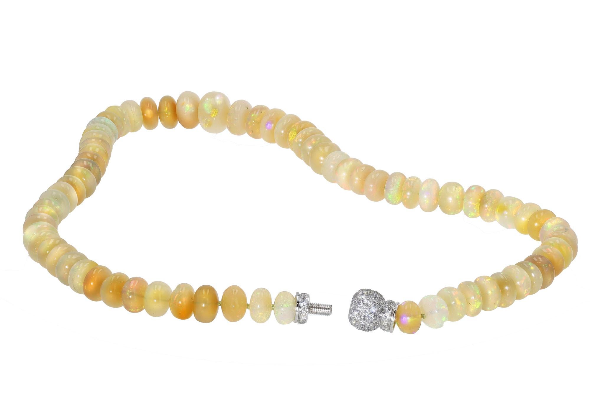 A stunning and dramatic opal bead necklace featuring fiery opals that display excellent play of color, creating a magical feeling for the wearer and onlookers. Each gem has been meticulously matched to create a stunning and close-knit statement with