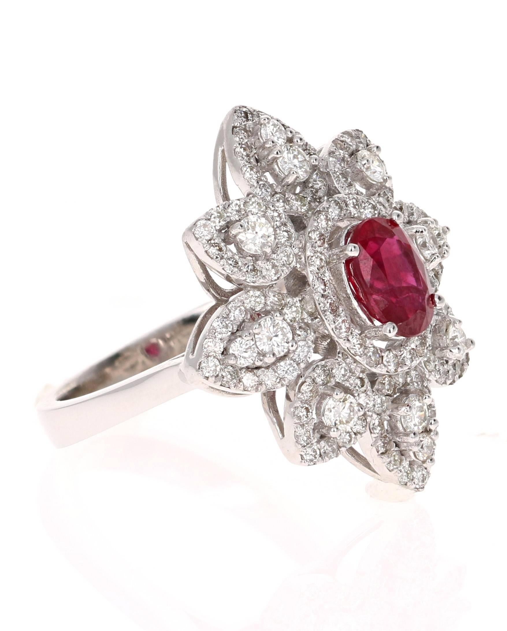 This ring is truly a remarkable piece that will surely add value to ones collection of jewels! 
There is a Oval Cut Ruby set in the center of the ring that weighs 1.12 carats.  There are 108 Round Cut Diamonds that weigh 1.02 carats (Clarity: VS2,