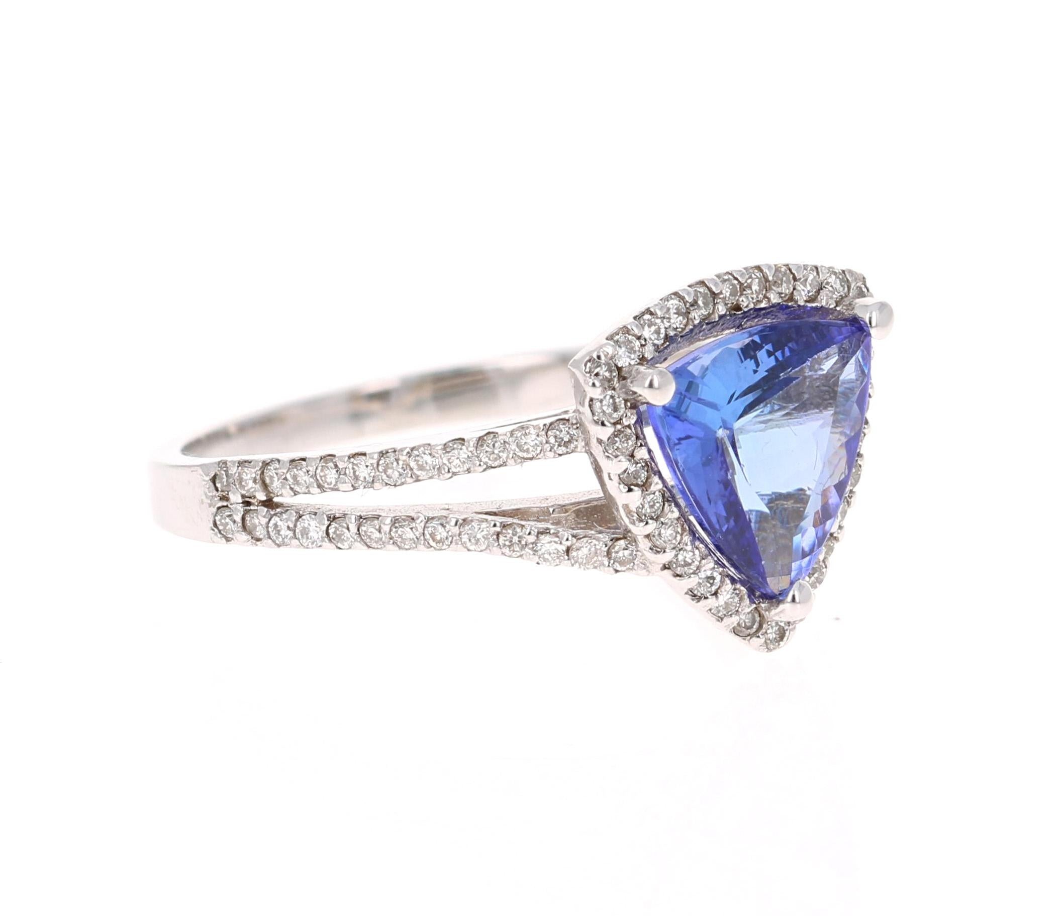 This ring has a gorgeous Trillion Cut Tanzanite that weighs 1.77 Carats. It is surrounded by 78 Round Cut Diamonds that weigh 0.37 Carats. 

Elegantly set in 14 Karat White Gold and weighs approximately 3.4 grams 

The ring is a size 7 and can be