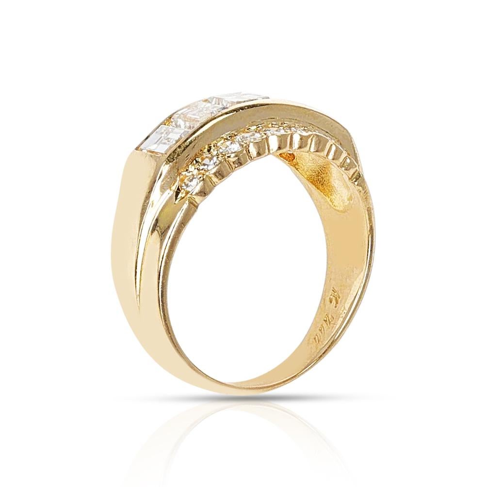 A Five Rectangular Cut Diamond Band with Two Rows of Round Diamonds made in 18 Karat Yellow Gold. The total diamond weight is appx. 2.14 carats. The total weight of the ring is 7.13 grams. The ring size is 8 US.  