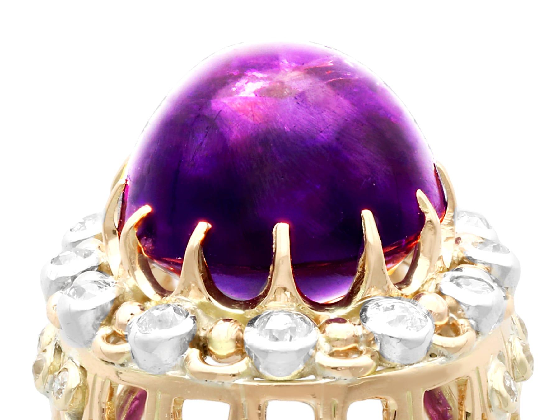 A stunning vintage 21.43 carat amethyst and 1.07 carat diamond, 14 karat yellow gold cocktail ring; part of our diverse antique jewelry and estate jewelry collections.

This stunning vintage cabochon cut amethyst and diamond ring has been crafted in